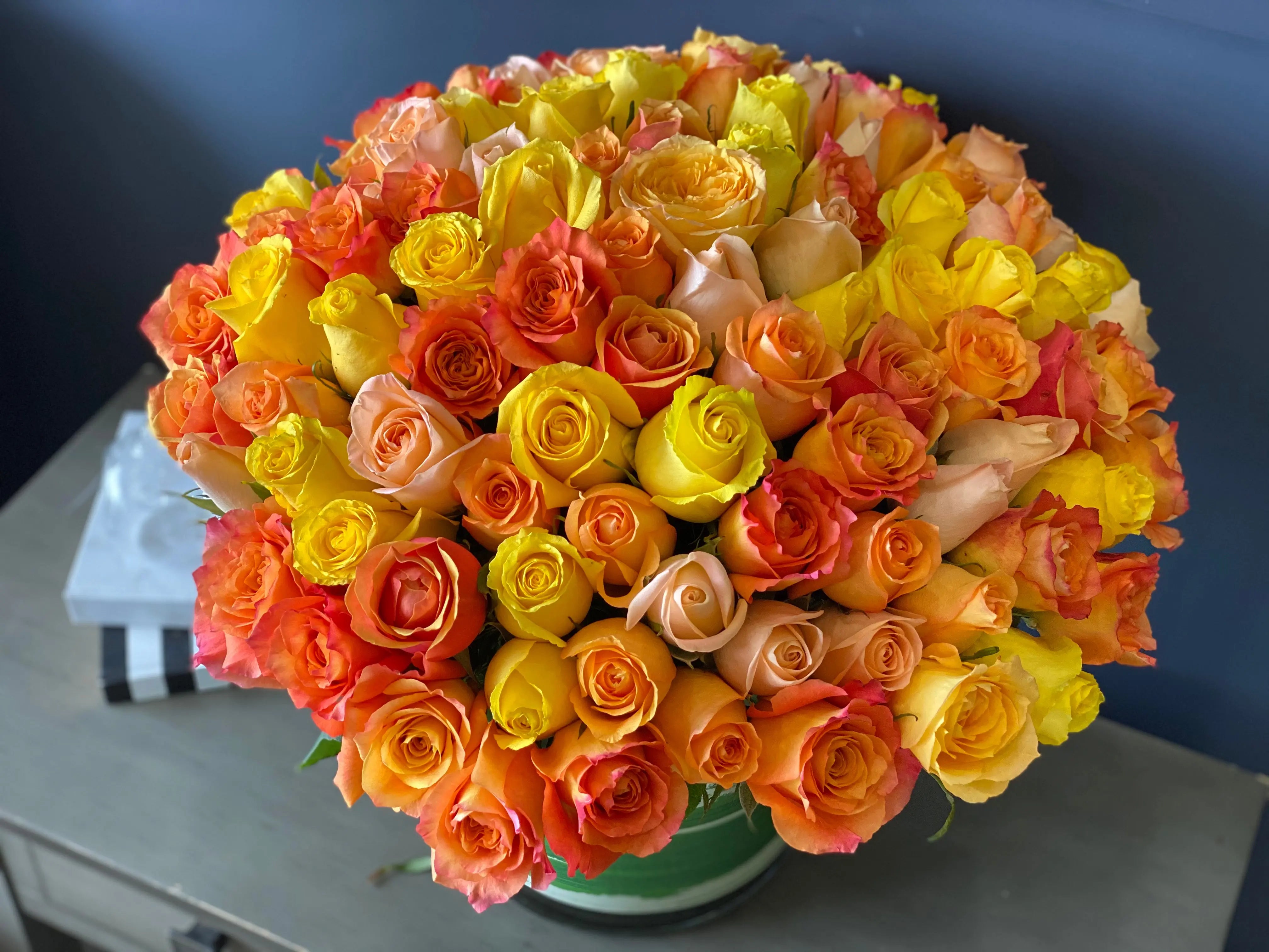 100 premium roses in warm yellow orange and peach colors