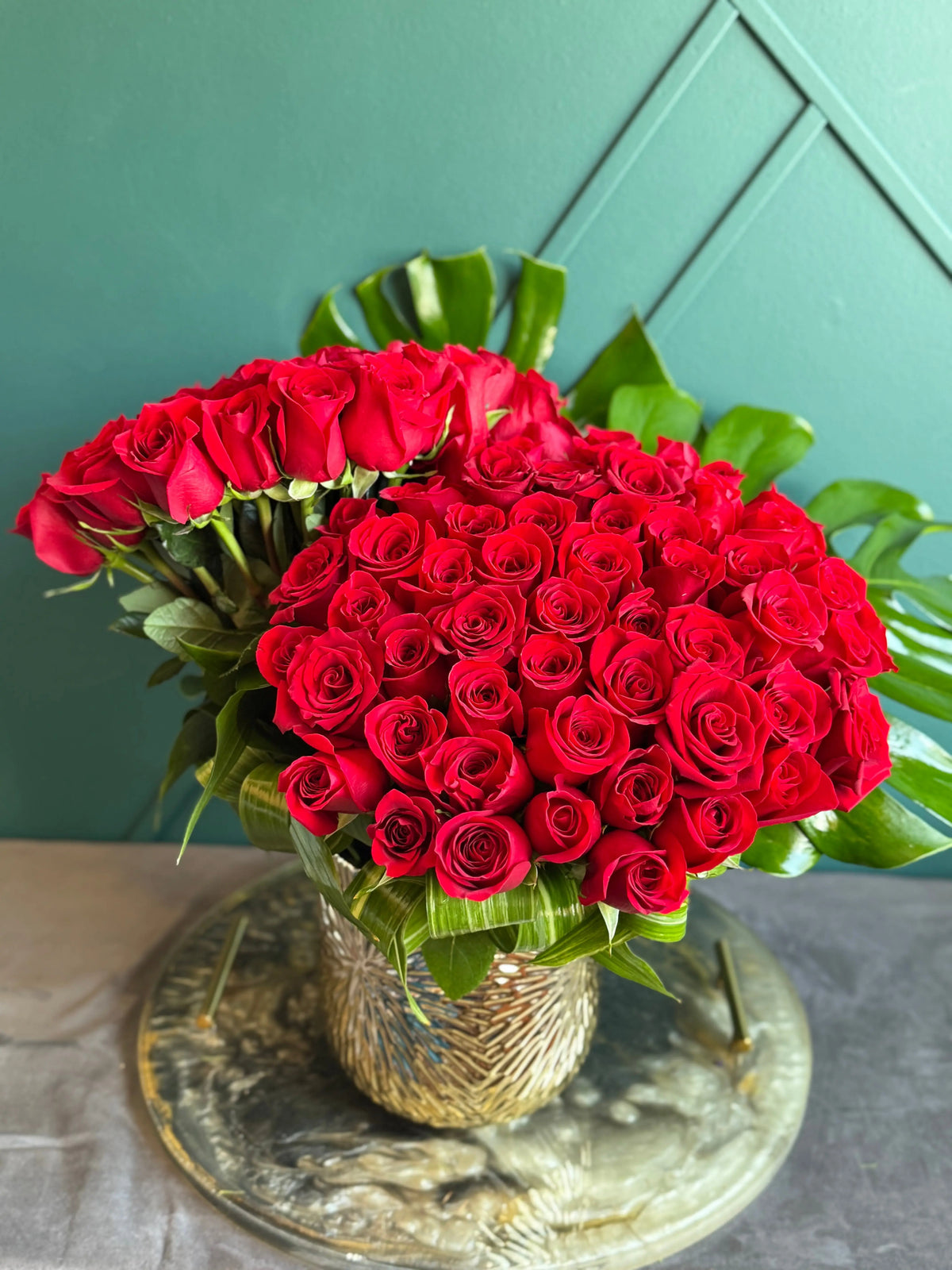 100 red roses in gold vase luxury arrangement Miami