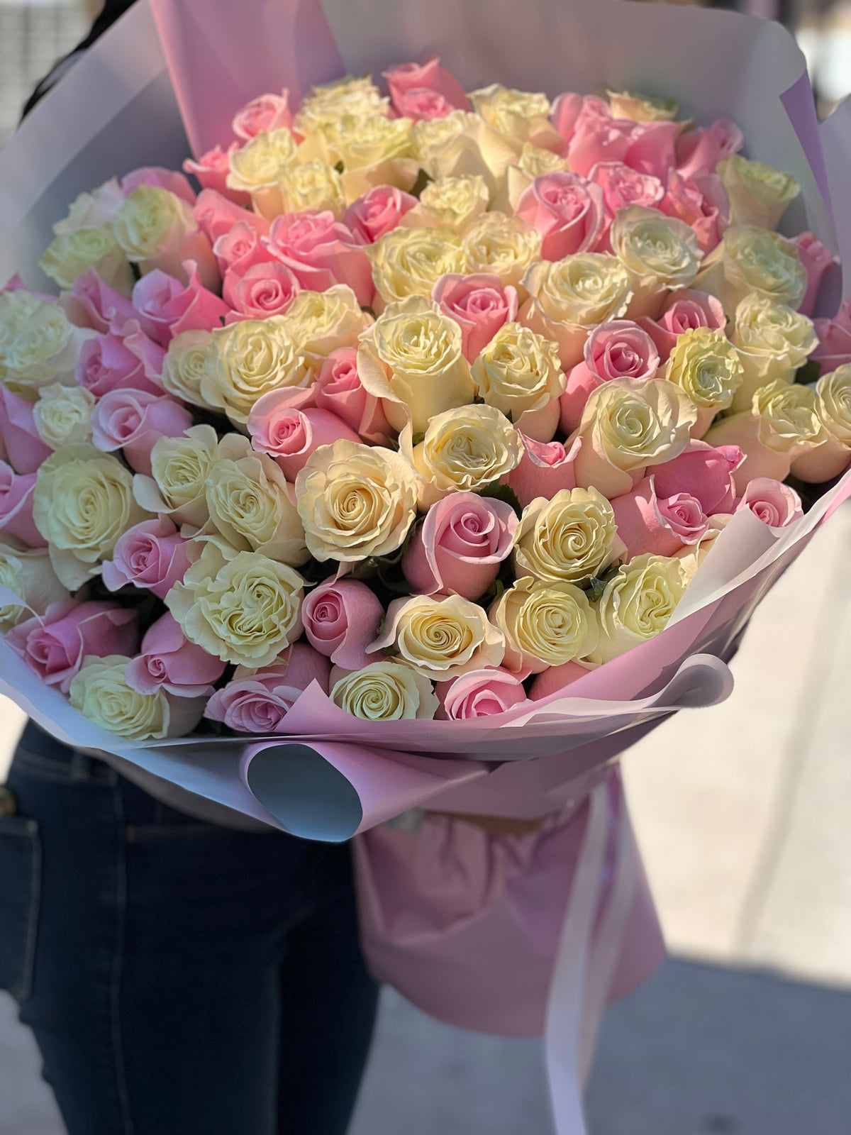 100 rose bouquet in white soft pink and deeper pink shades