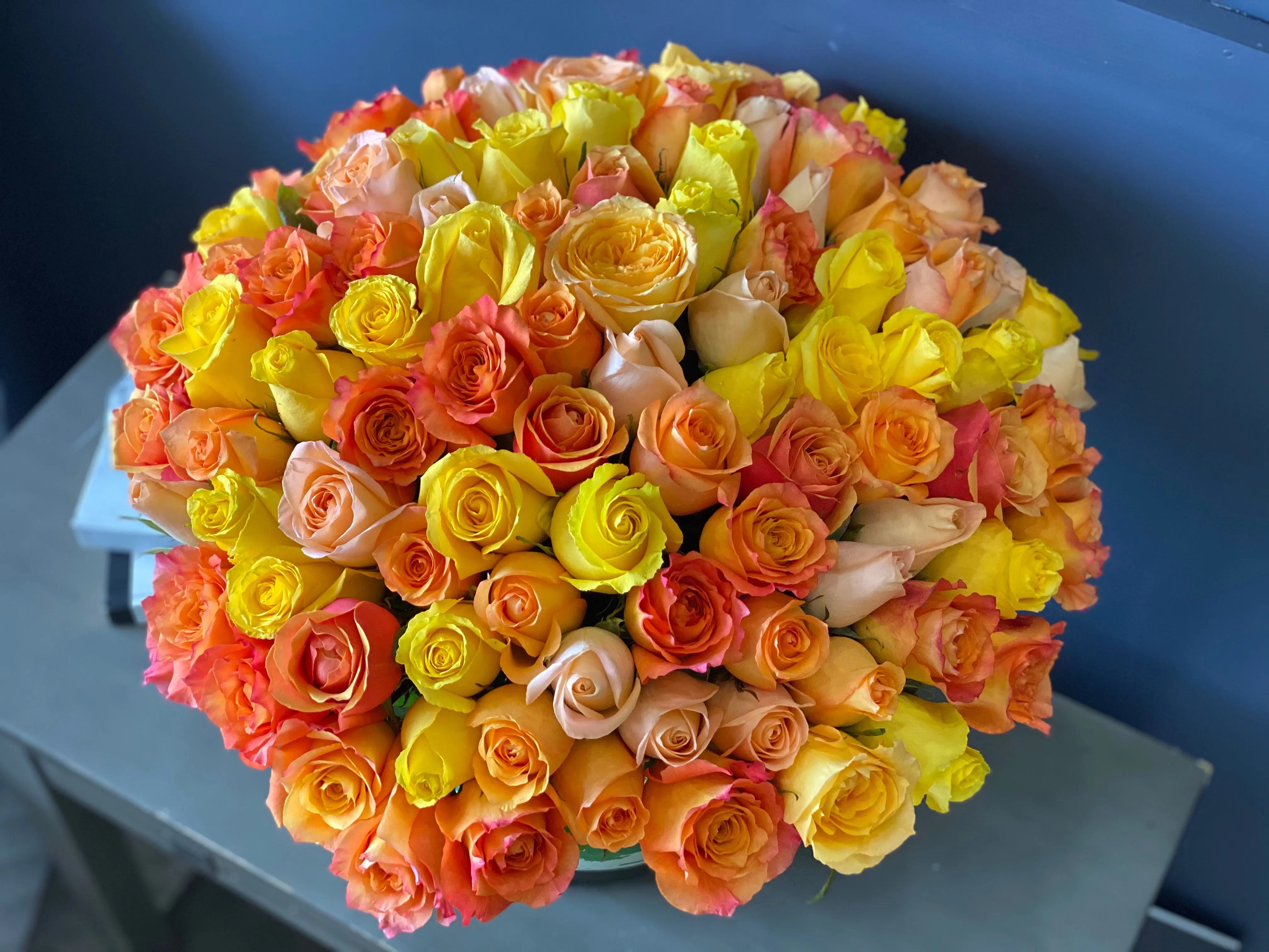 100 yellow and orange roses luxury arrangement in Miami