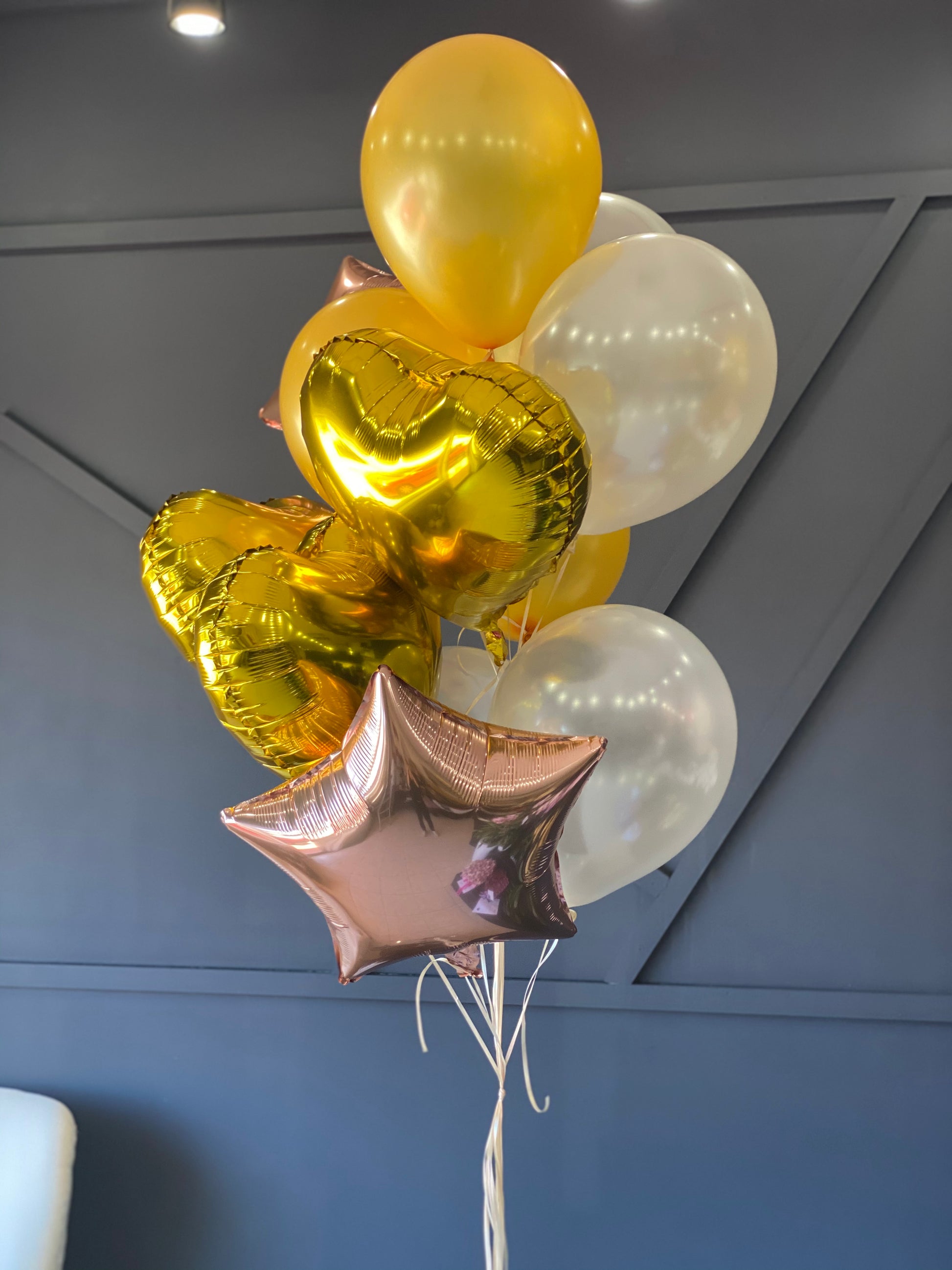 12 latex and foil balloon bouquet in yellow ivory gold and rose gold by Luxury Flowers Miami

