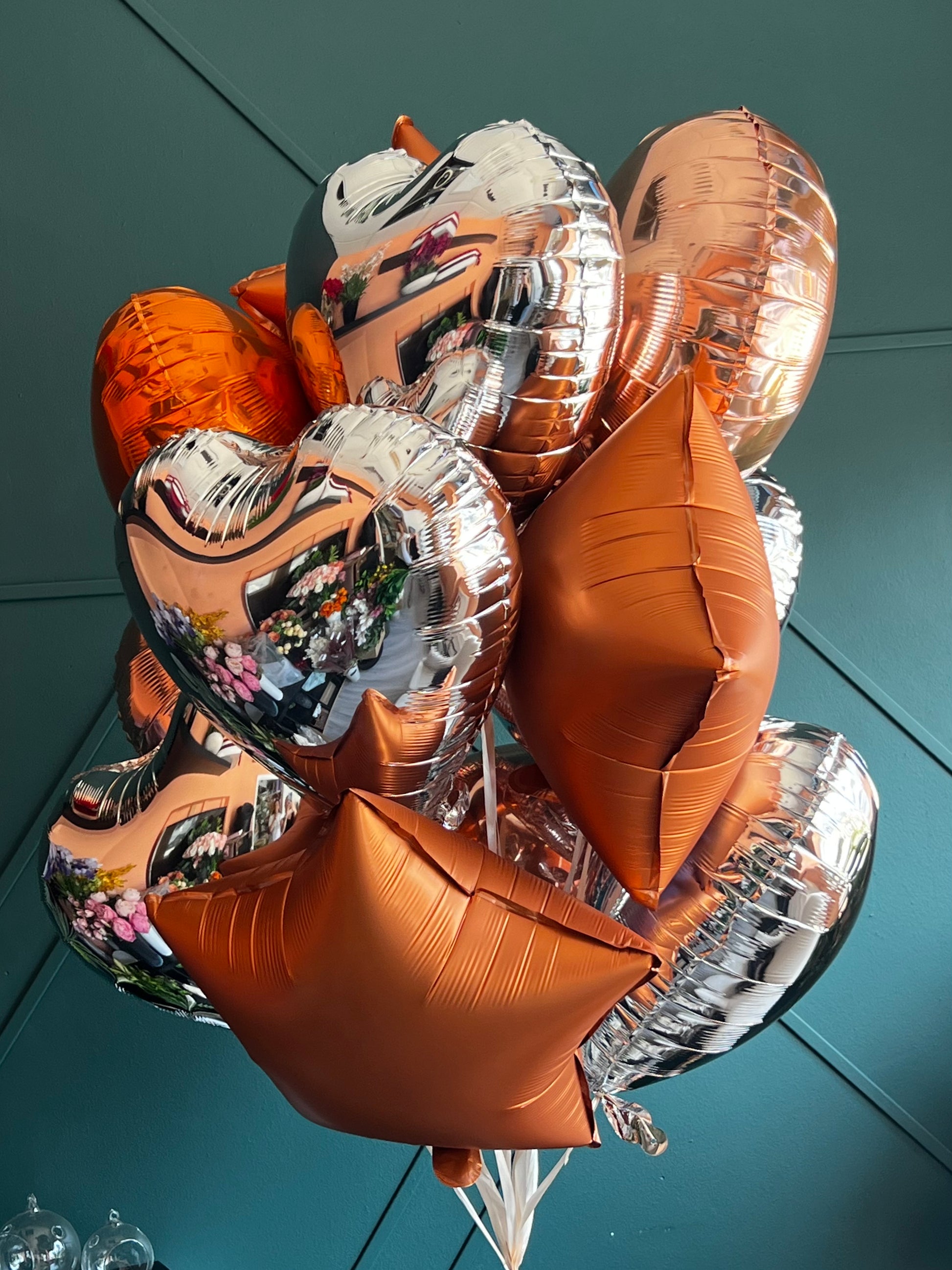 12 metallic foil balloons arranged by Luxury Flowers Miami