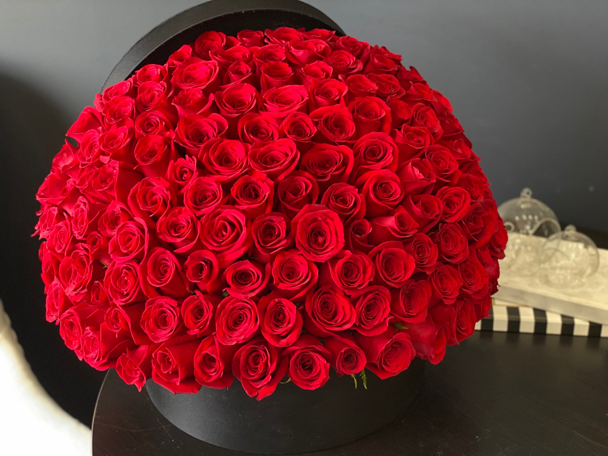 150 premium red roses in black box for Miami flower delivery