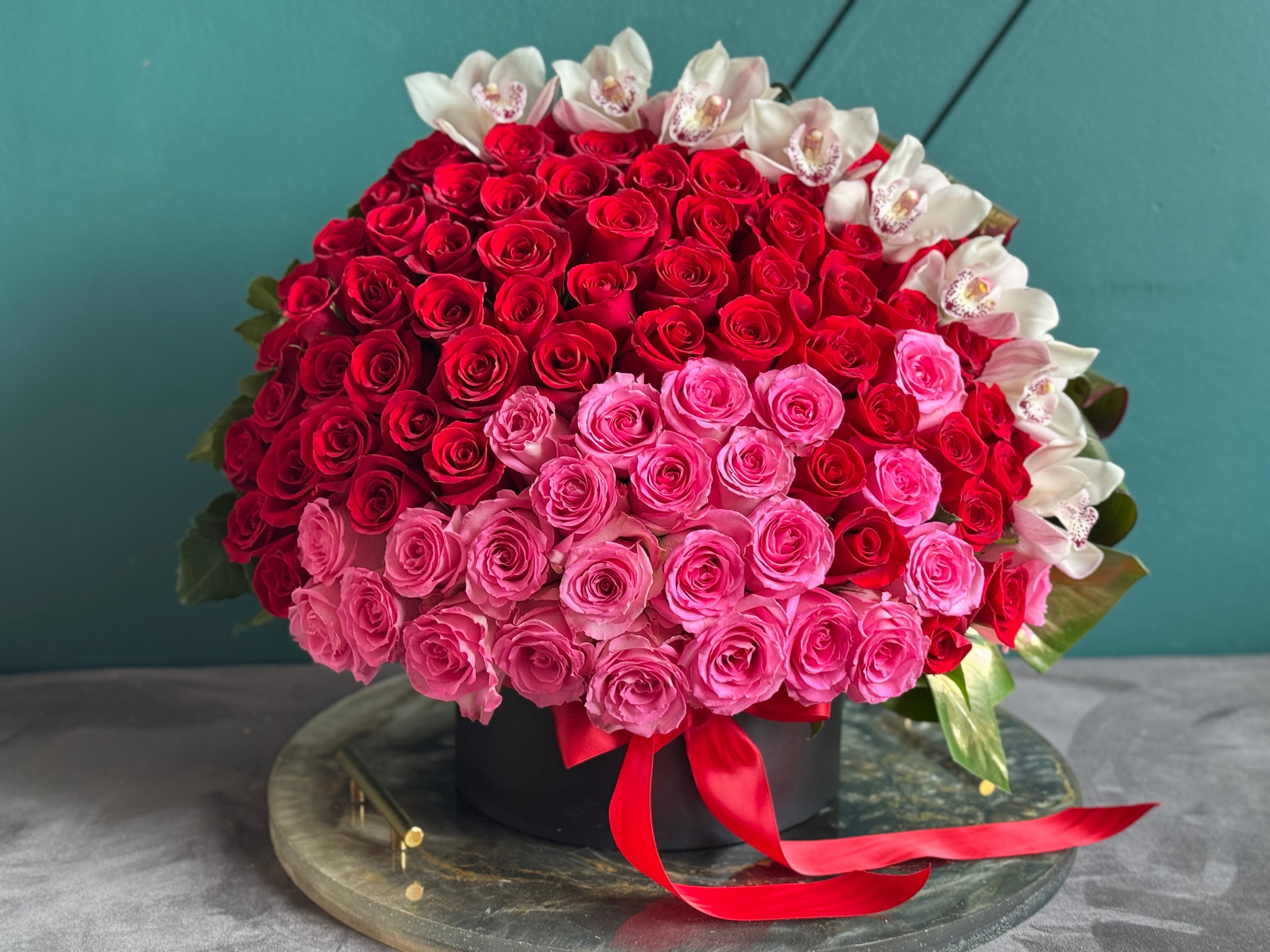 150 red and pink roses with cymbidium orchids in luxury flower box Miami