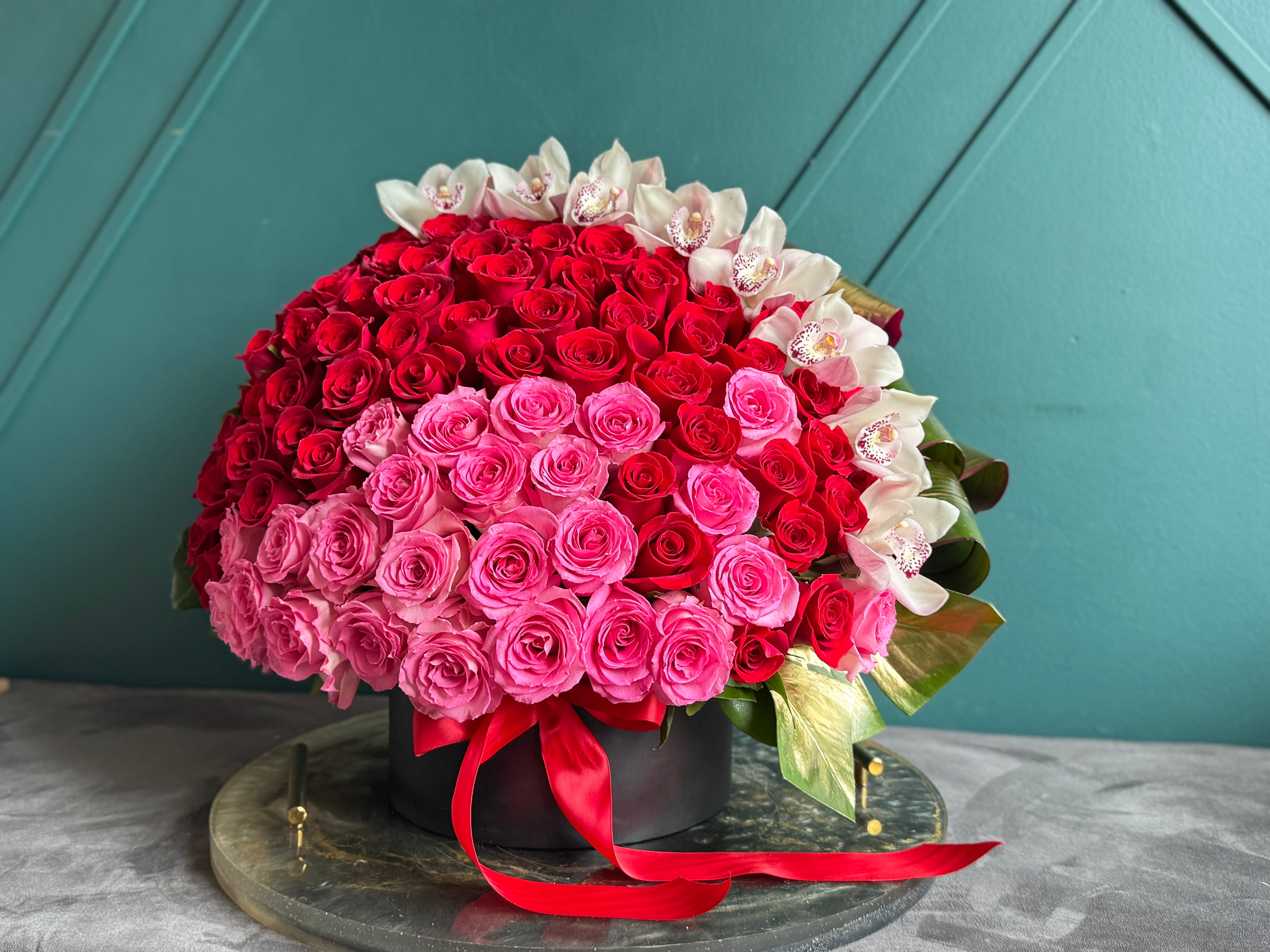 150 roses romantic gift with cymbidium orchids Miami