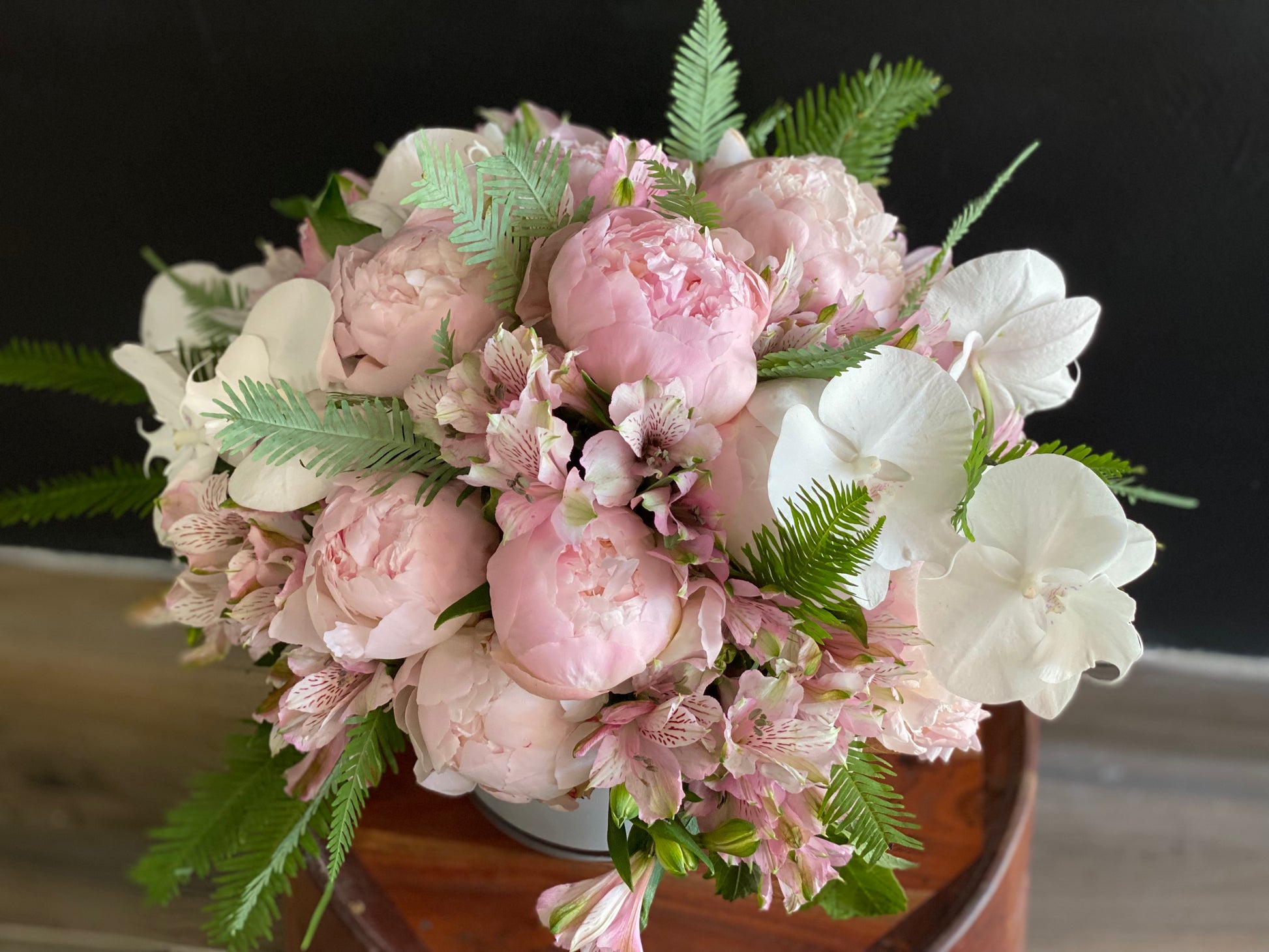 15 to 20 peonies with orchids and alstroemeria arrangement
