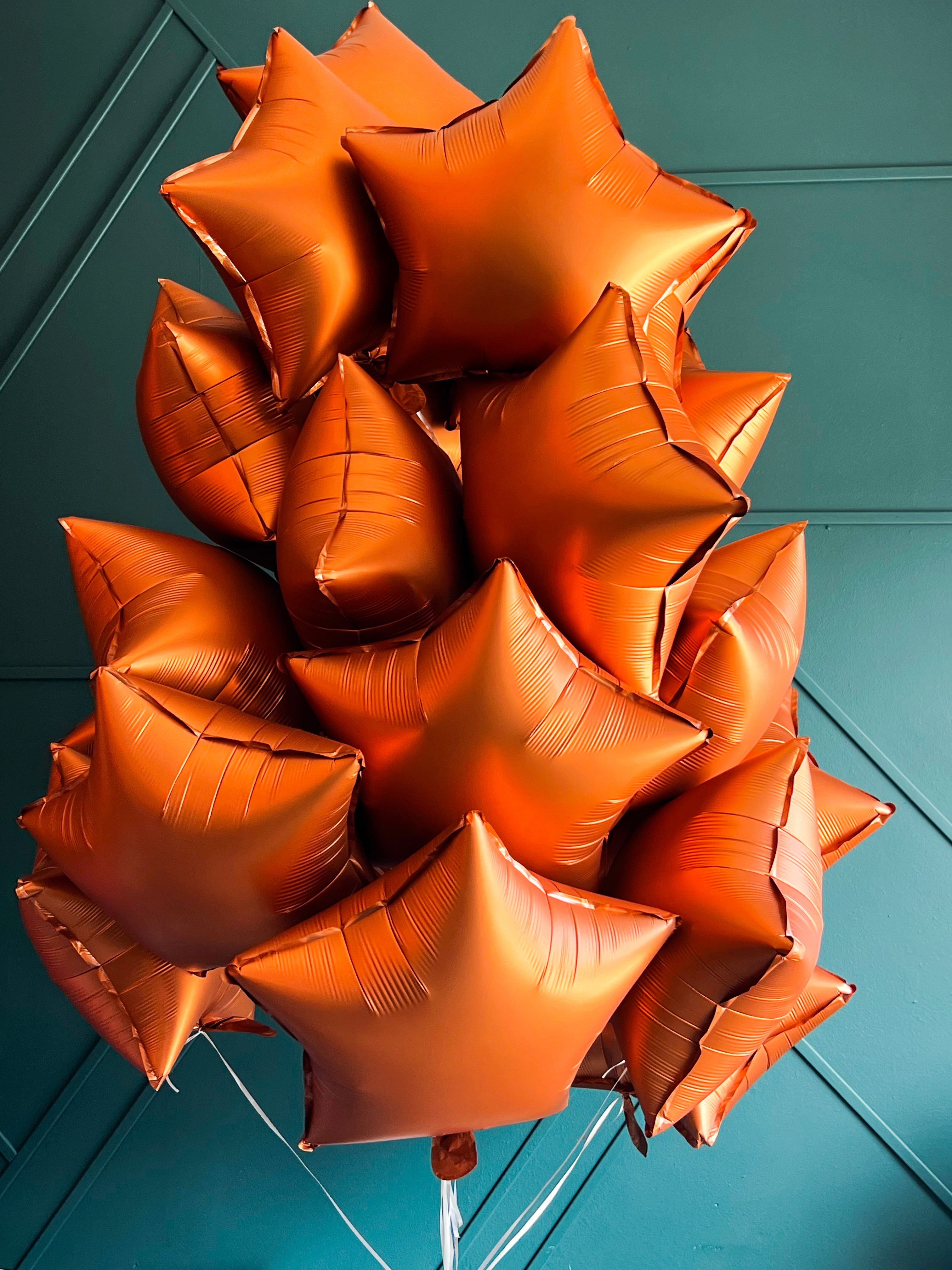 24 bronze foil balloons arranged by Luxury Flowers Miami
