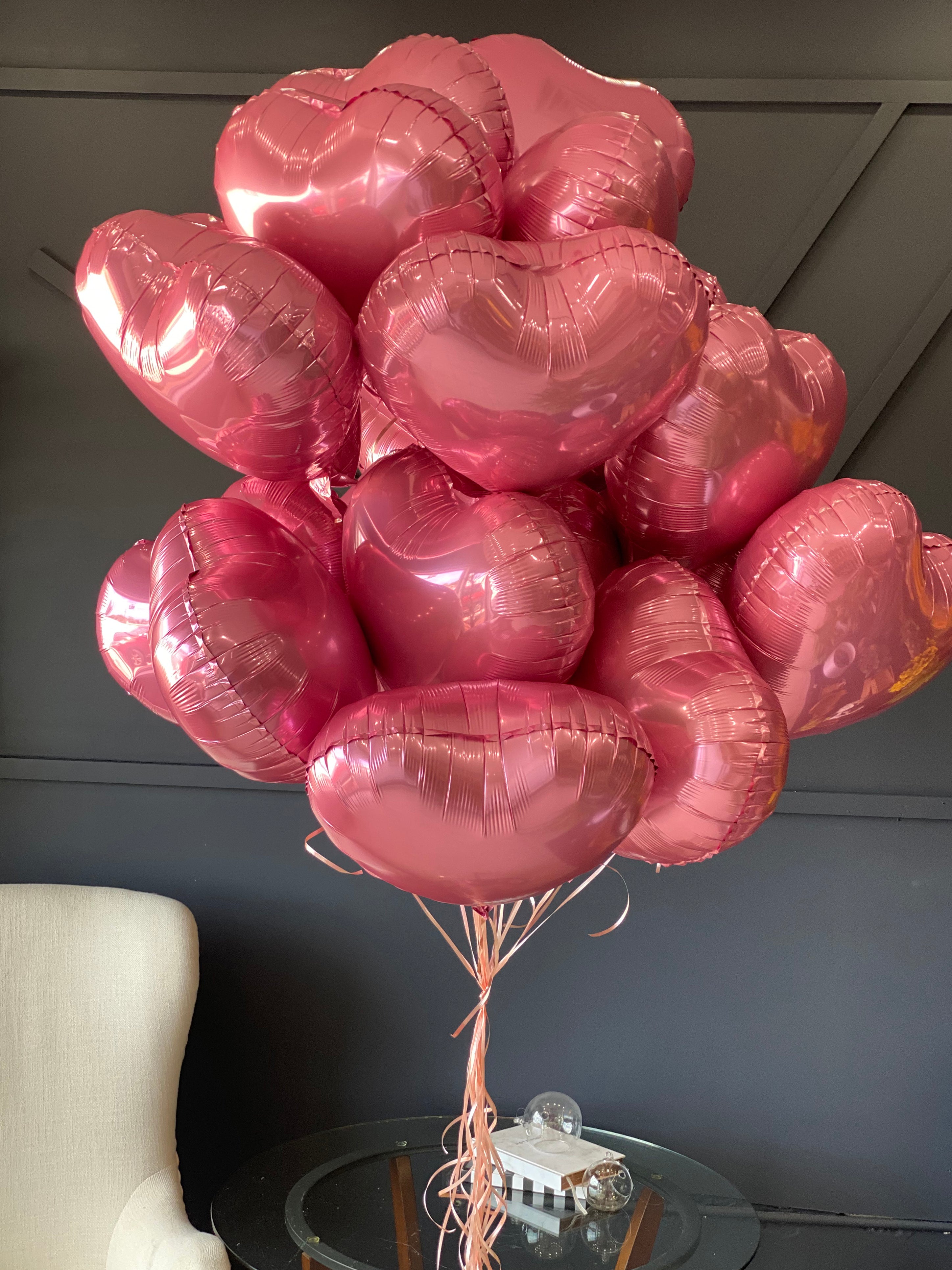 24 pink heart-shaped balloons arranged by Luxury Flowers Miami
