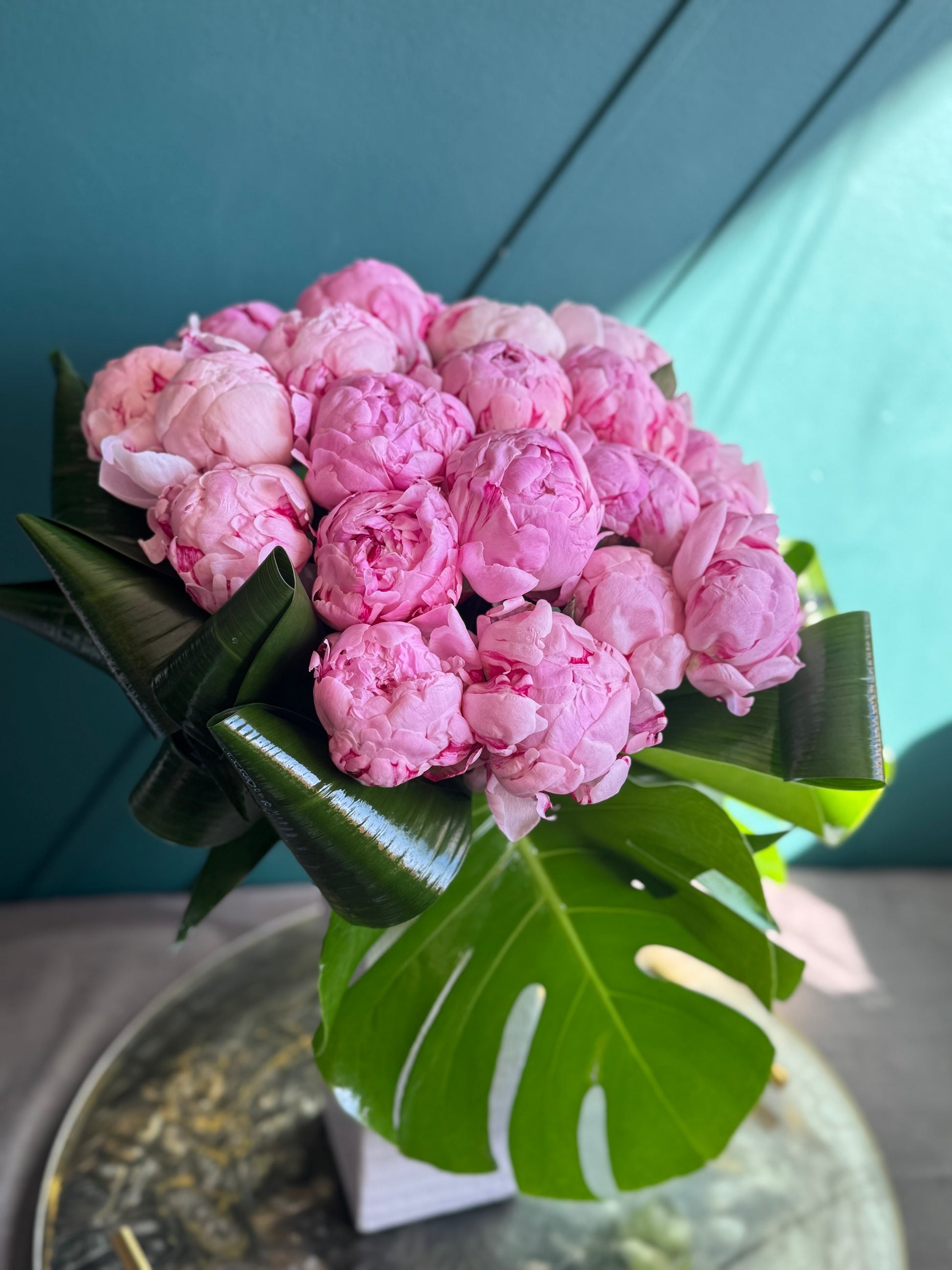 24 pink peonies Miami luxury flower arrangement in tall square vase
