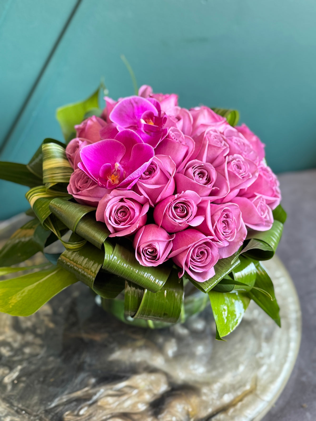 24 purple roses arrangement in fishbowl vase Miami