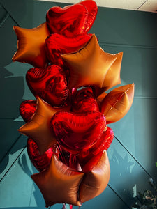 24 red and bronze foil balloons arranged by Luxury Flowers Miami