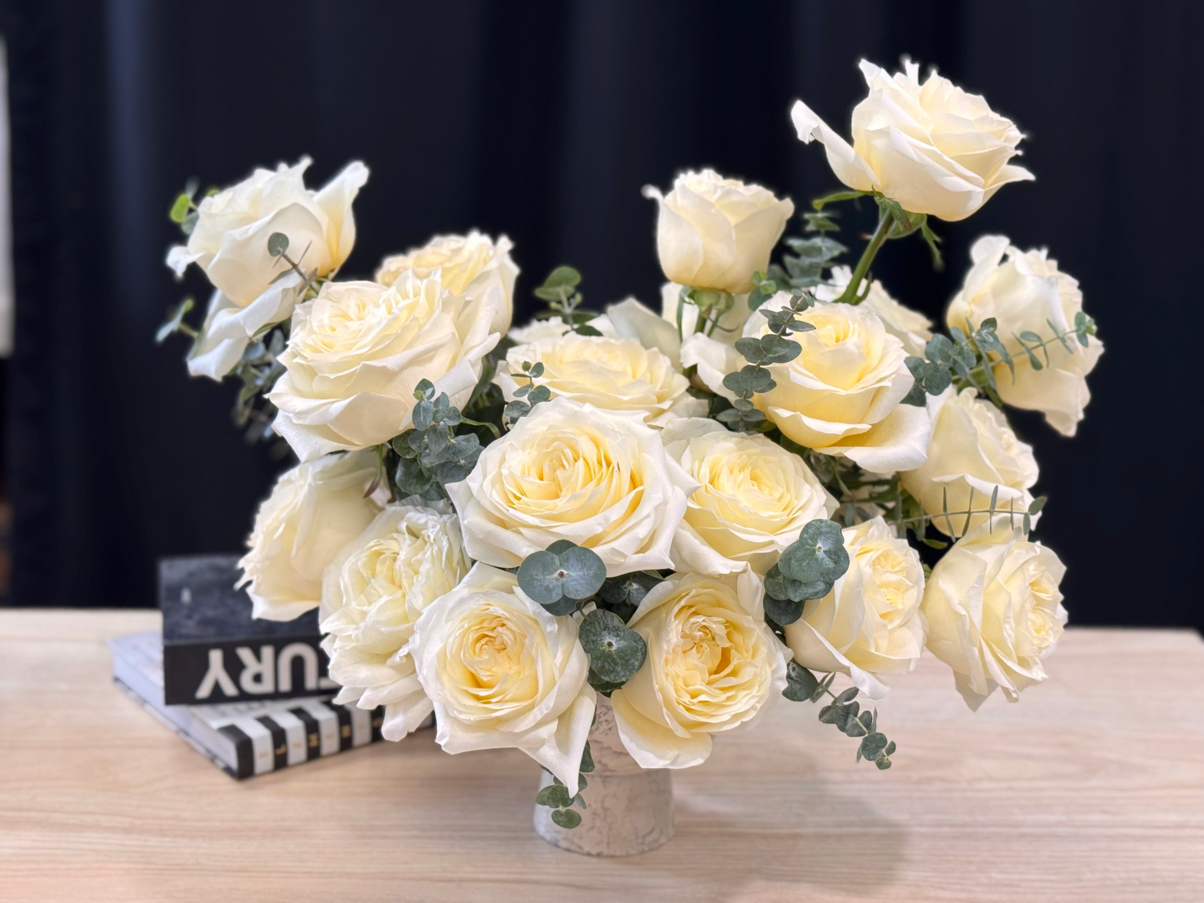 24 white French roses in an elegant vase
