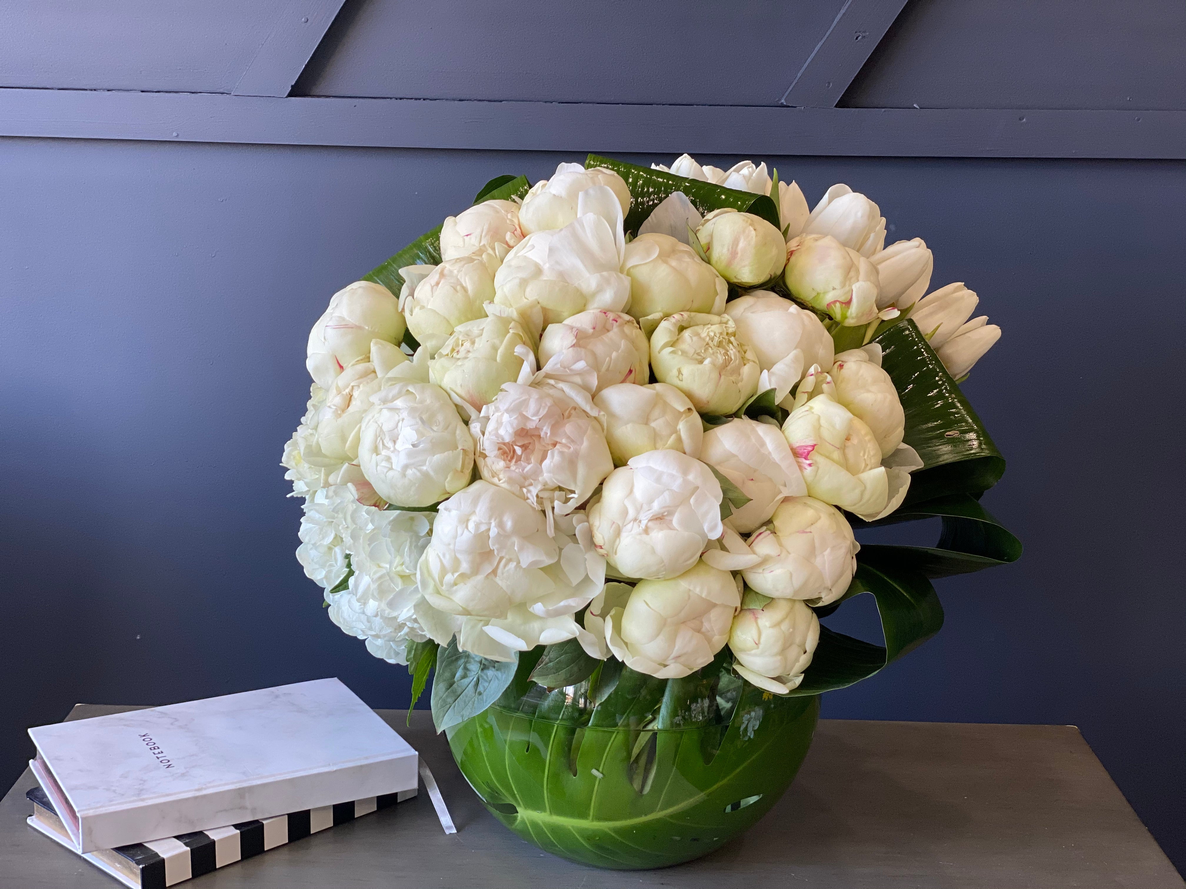 24 white peonies with white tulips and hydrangeas
