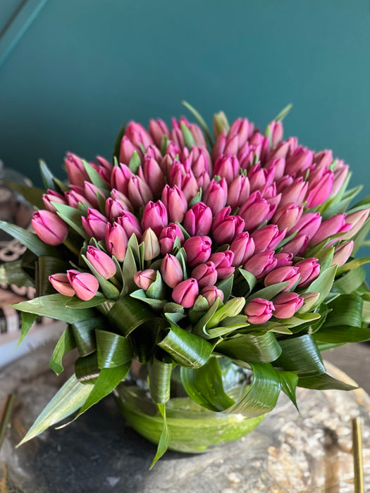 75 Pink Tulips In Fishbowl Clear Vase