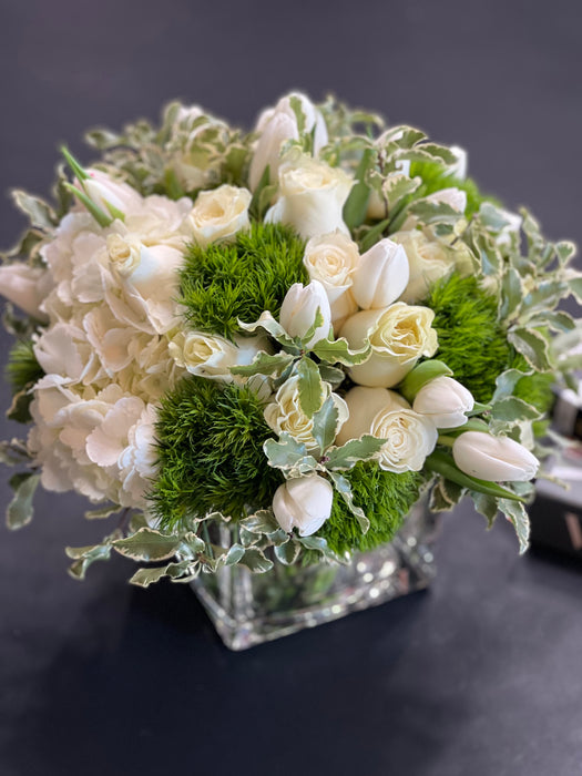 White and green flower design in a vase