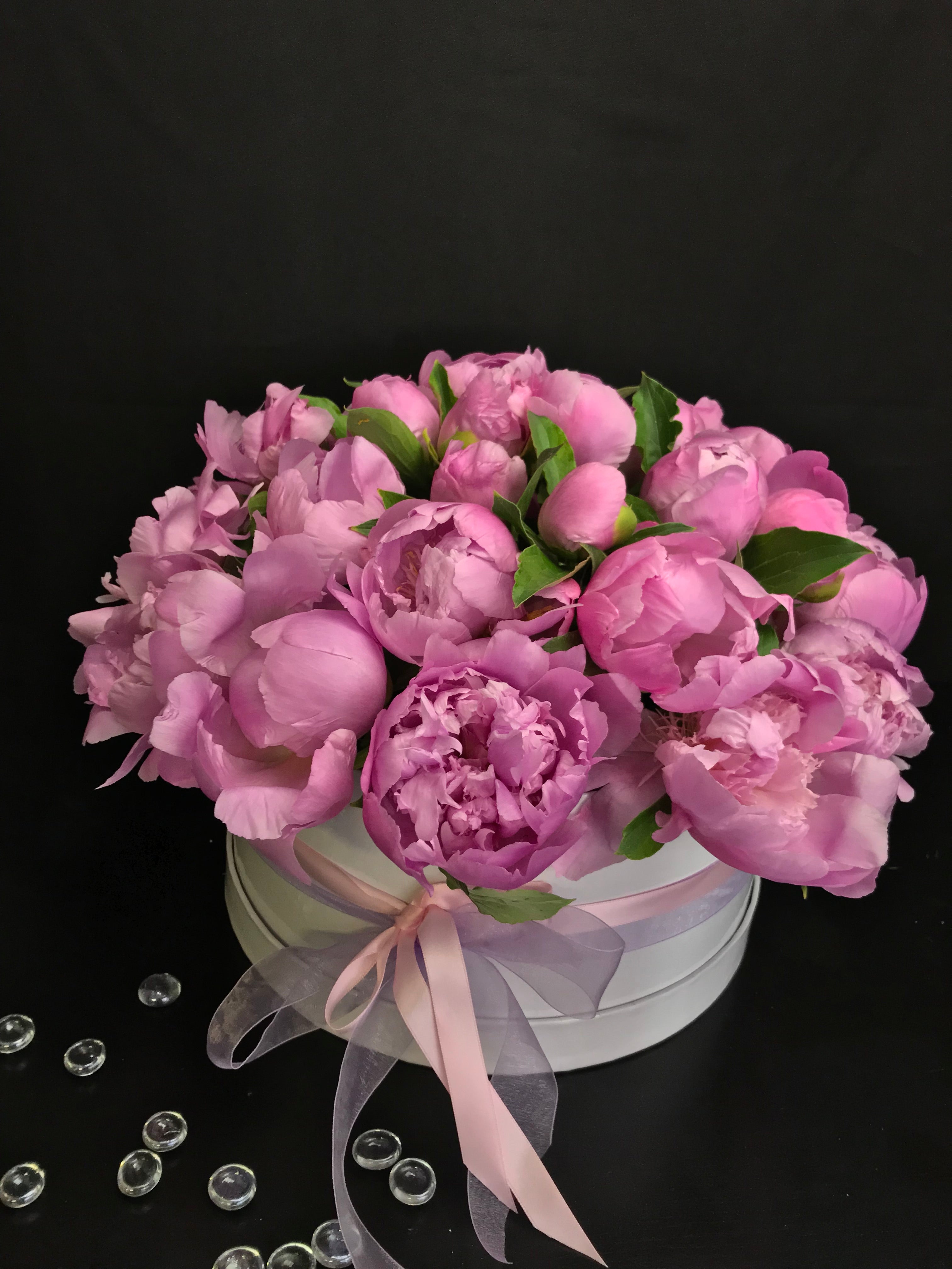 36 pink peonies arranged in an elegant white box