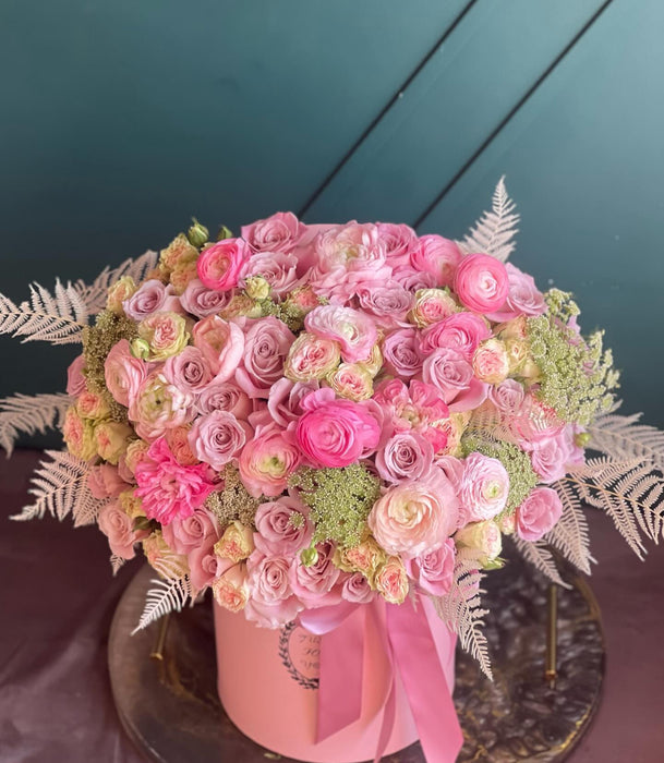 Box with roses and mixed flowers