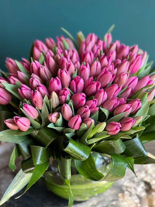 75 Pink Tulips In Fishbowl Clear Vase