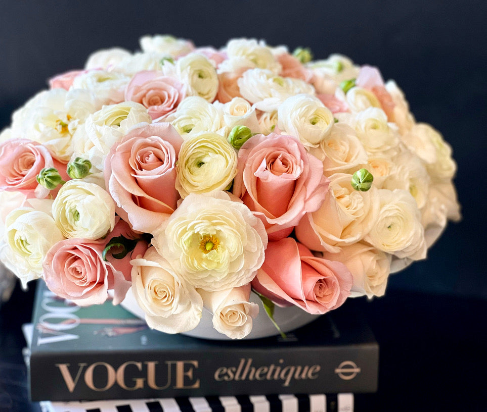 50 white and pink roses with ranunculus arrangement
