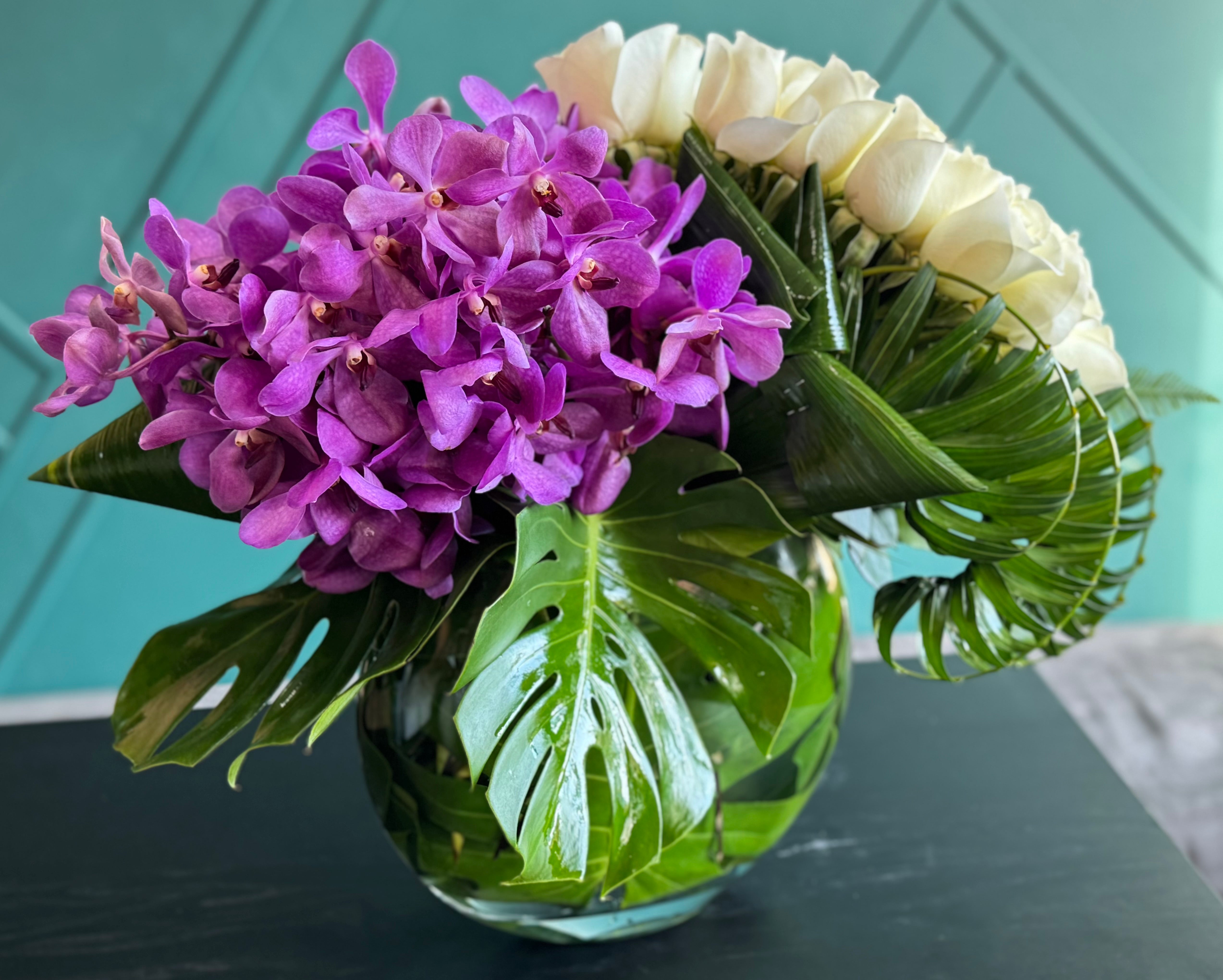 50 white roses and Mokara orchids luxury arrangement in Miami