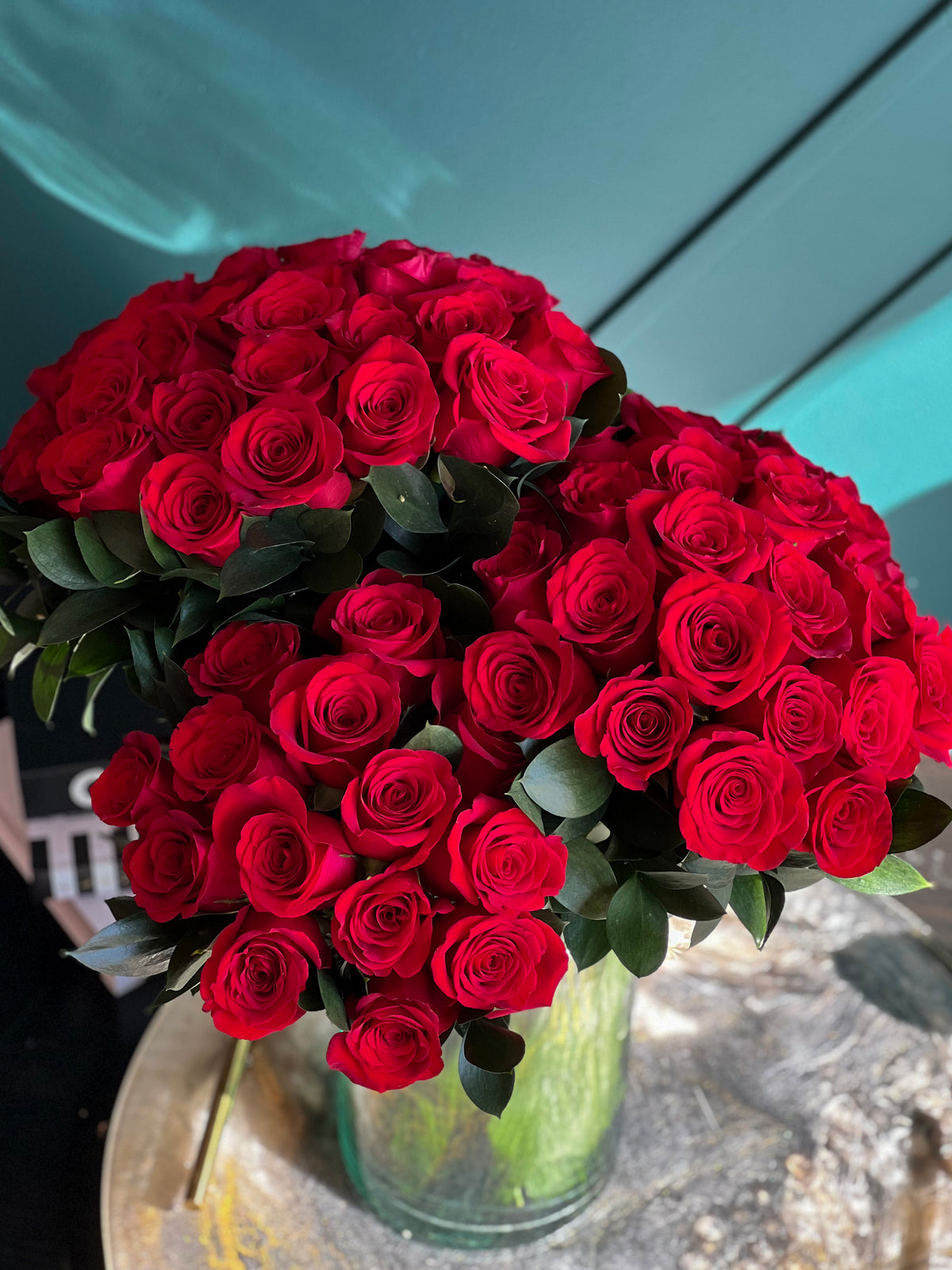 72 red roses in a vase by Luxury Flowers Miami
