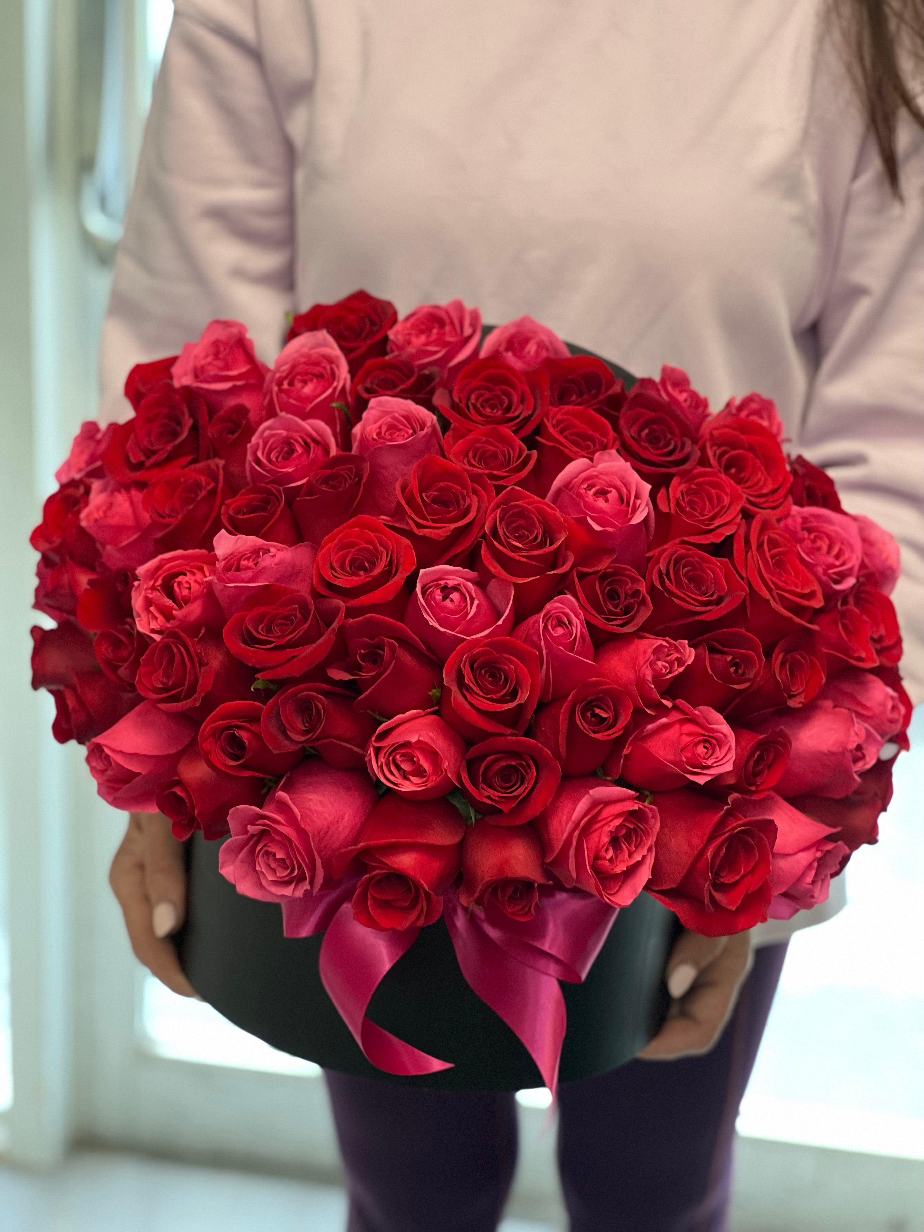 75 premium red and hot pink roses in an elegant box