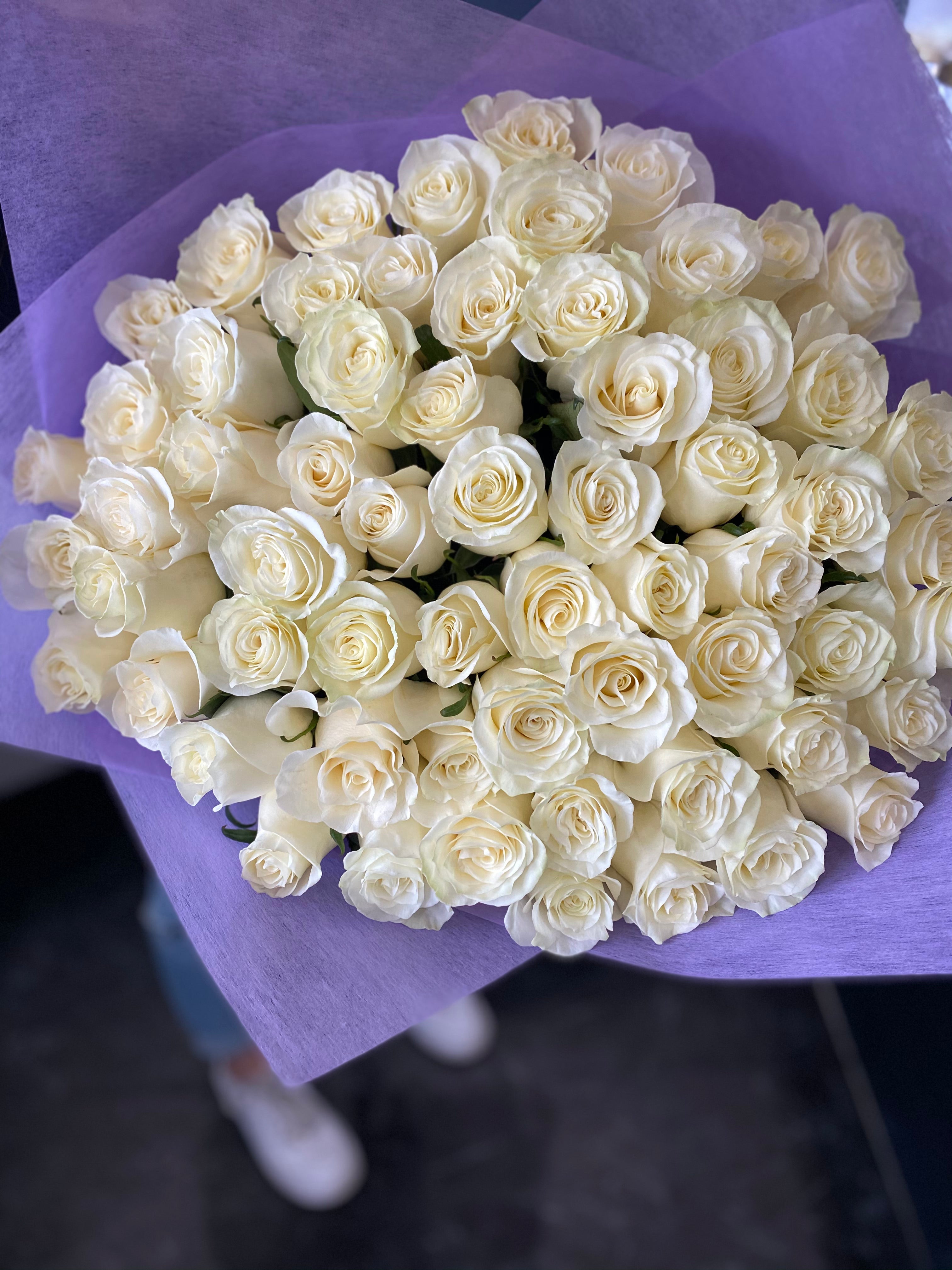 75 premium white roses with lavender wrapping
