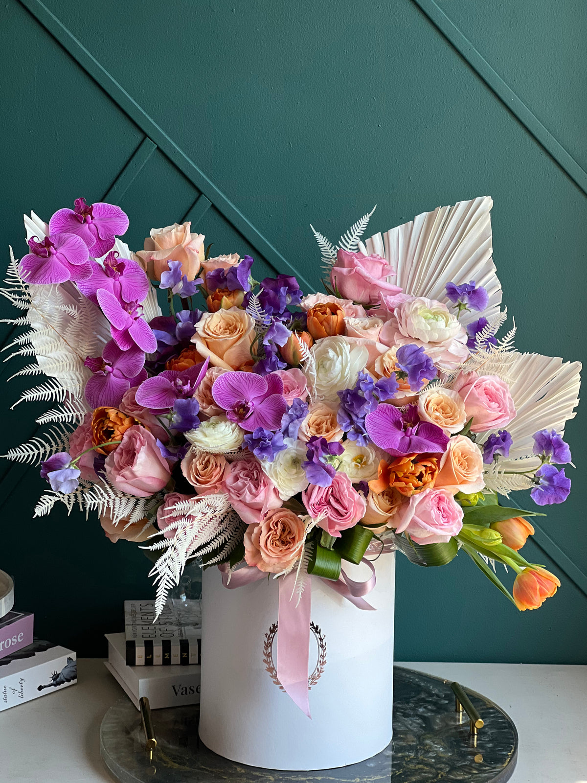 Artistic flower arrangement in luxury hat box Miami