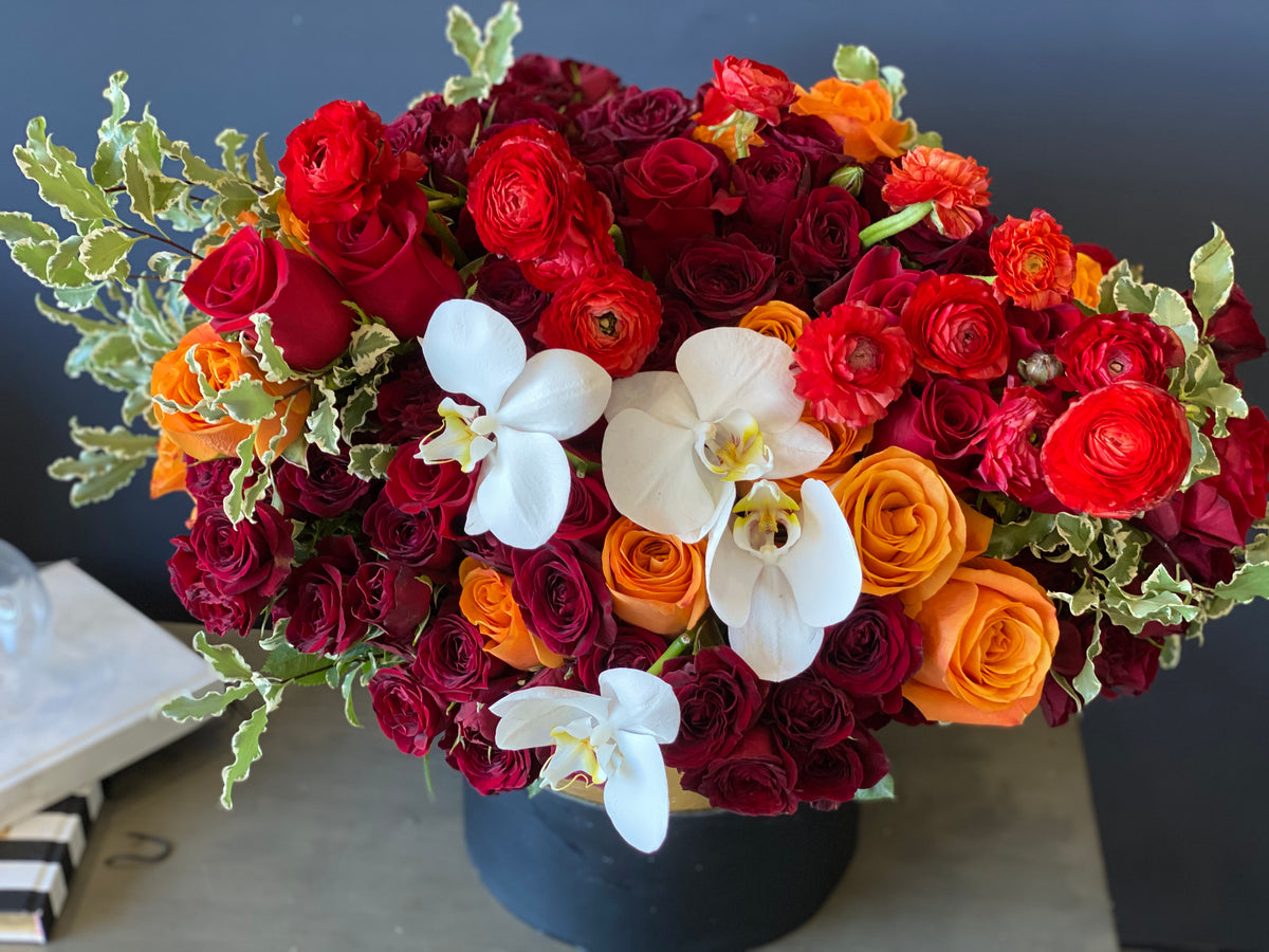 Autumn flower box with roses spray roses and ranunculus