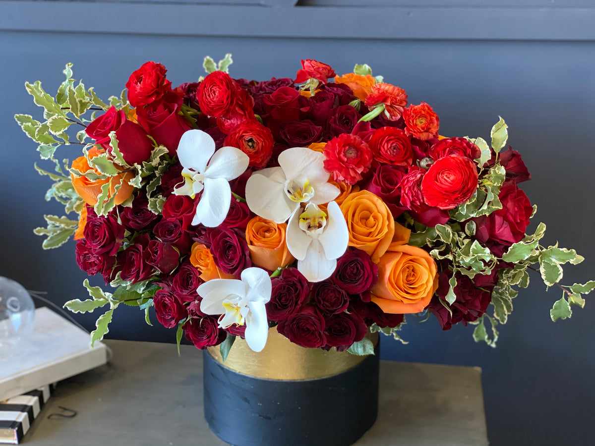Autumn's Beauty flower box with red roses and white orchids