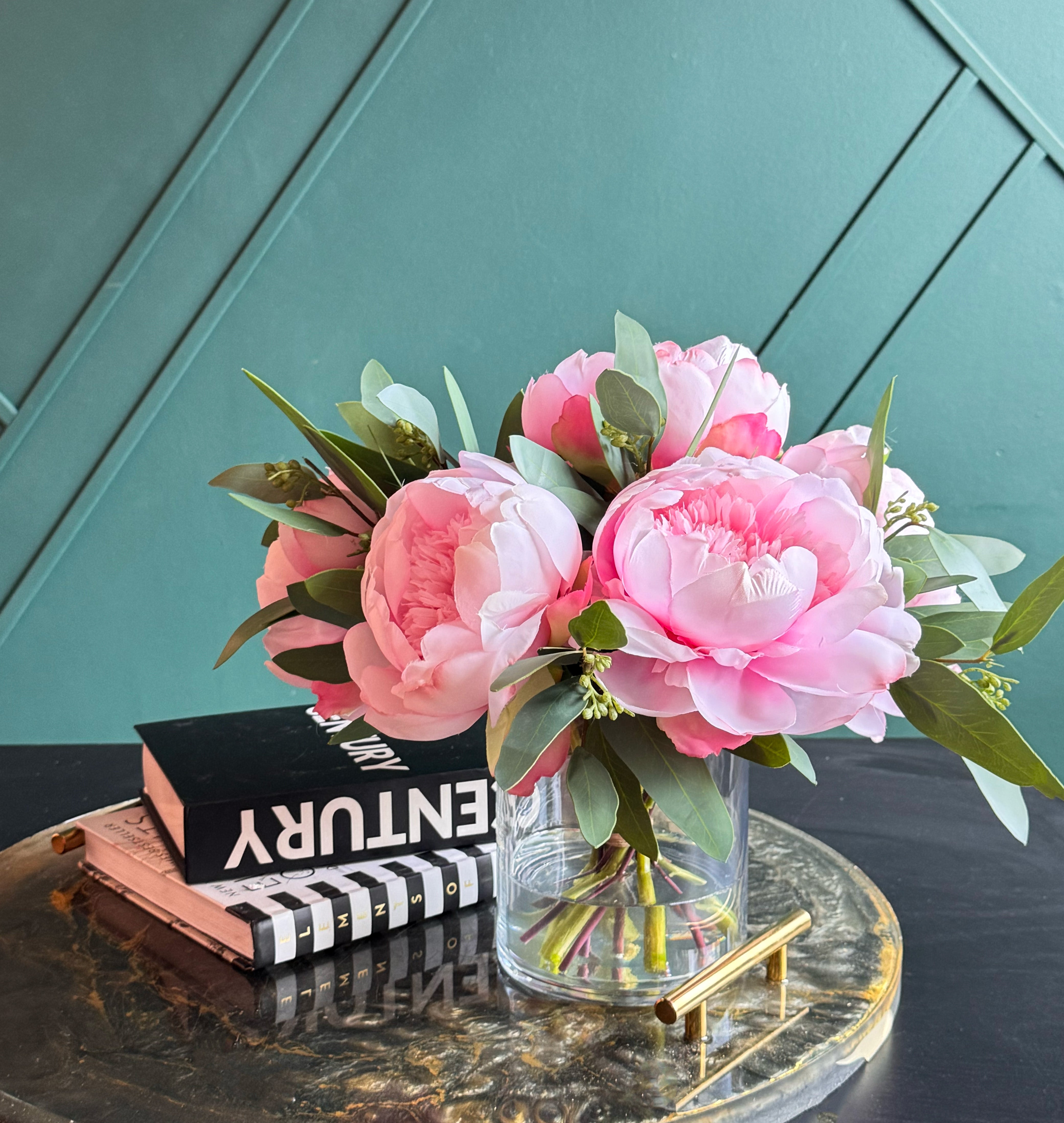 Beautiful handcrafted artificial pink peonies arranged in a modern glass vase.