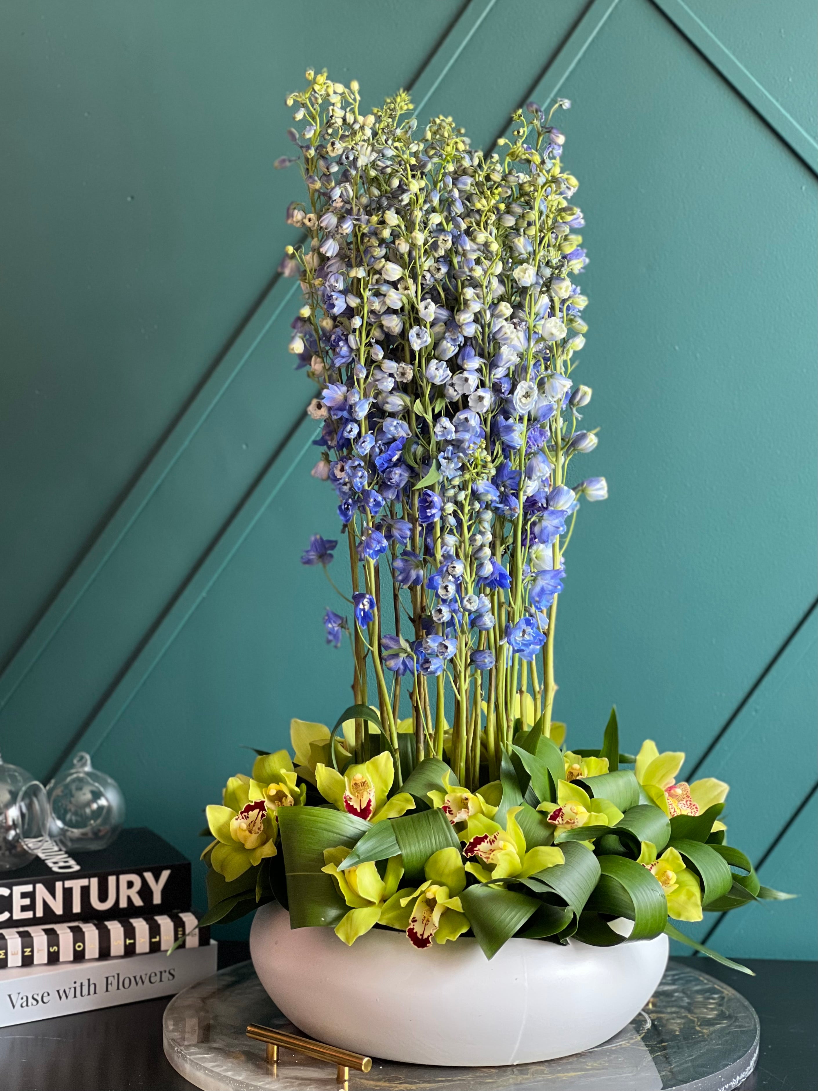 Blue delphinium and green cymbidium orchid arrangement Miami
