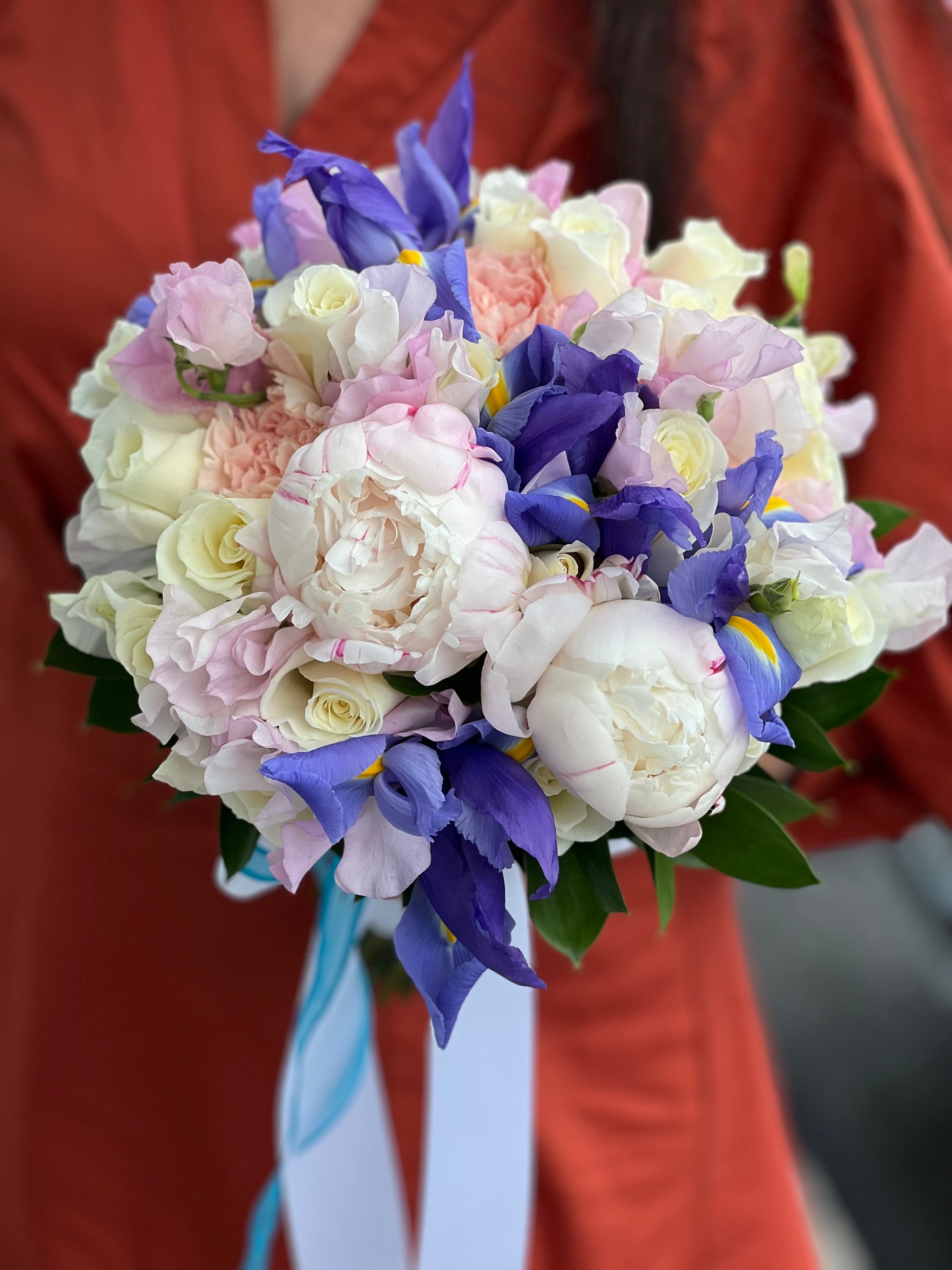 Blue iris bridal bouquet with blush peonies and ivory roses