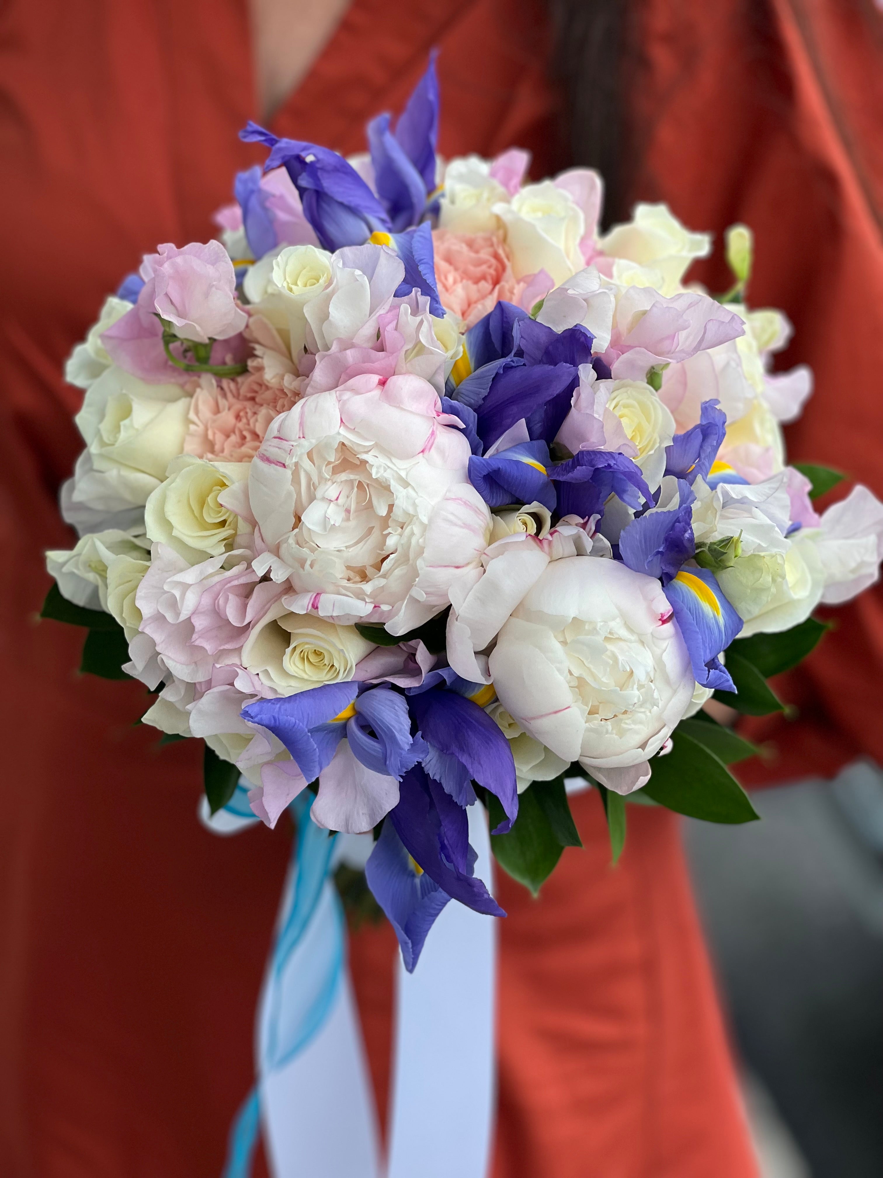 Blue iris bridal bouquet with blush peonies and ivory roses