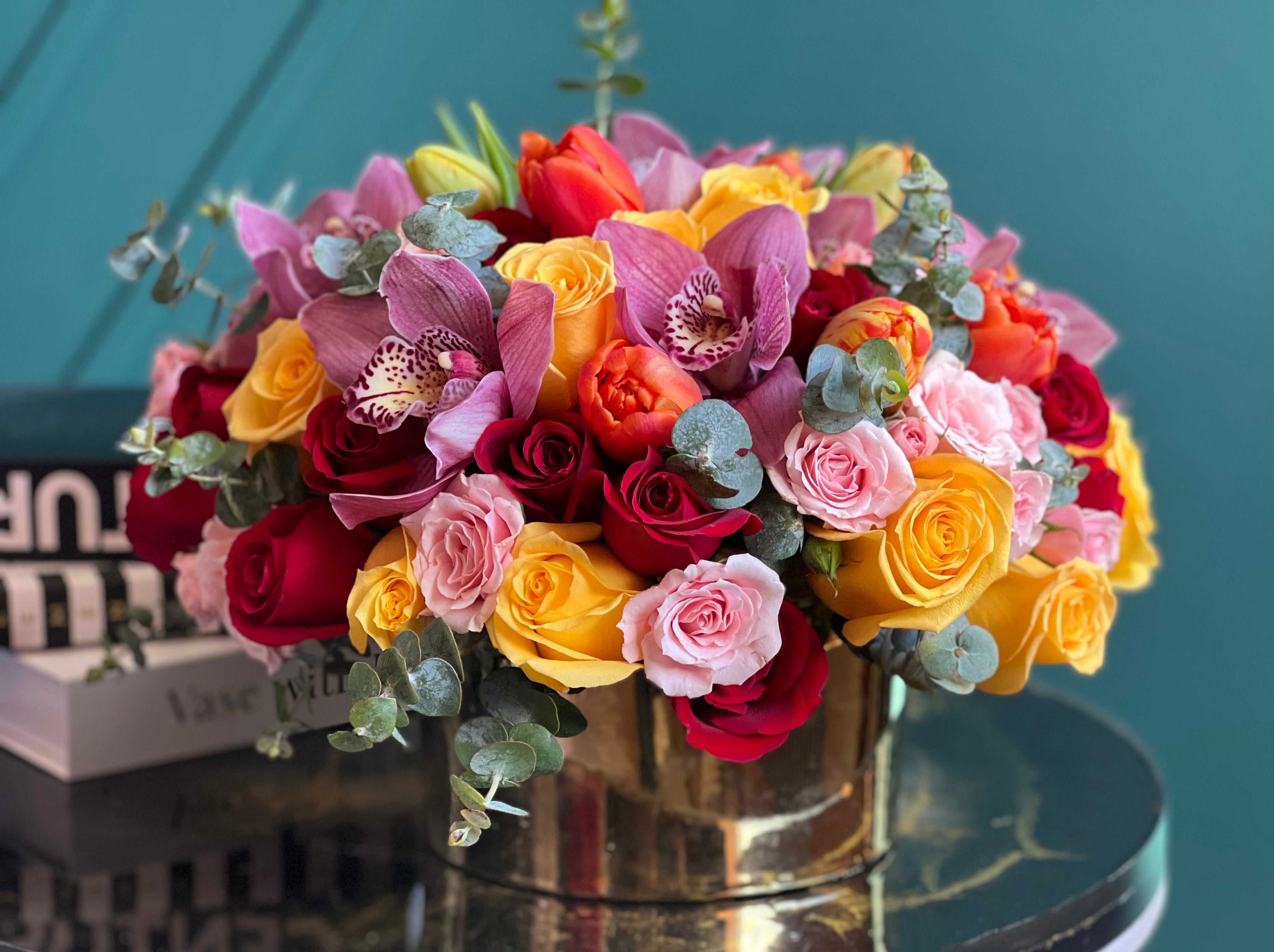 Bright Beauty luxury flower arrangement in a gold vase