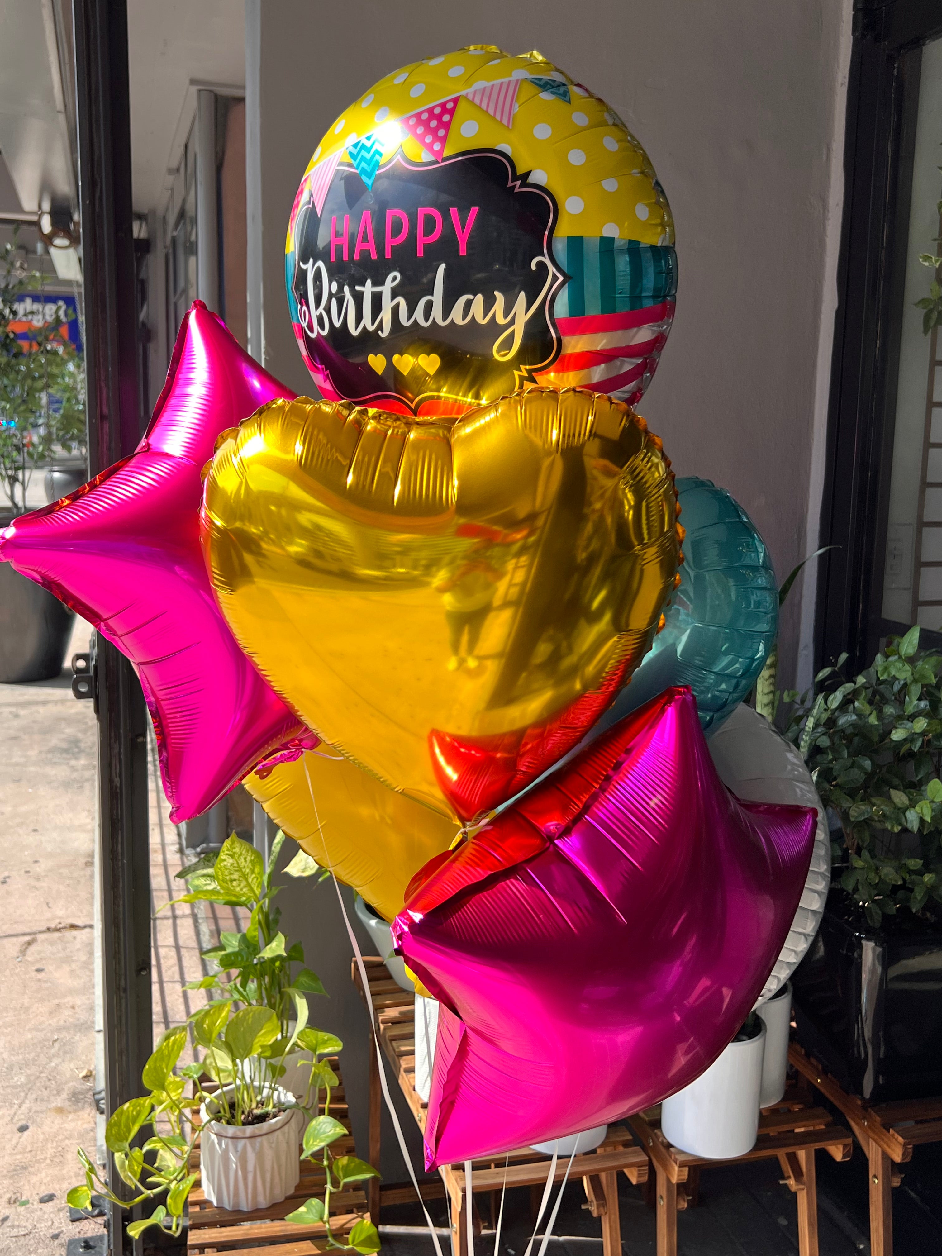 Colorful birthday balloons for flower and balloon delivery