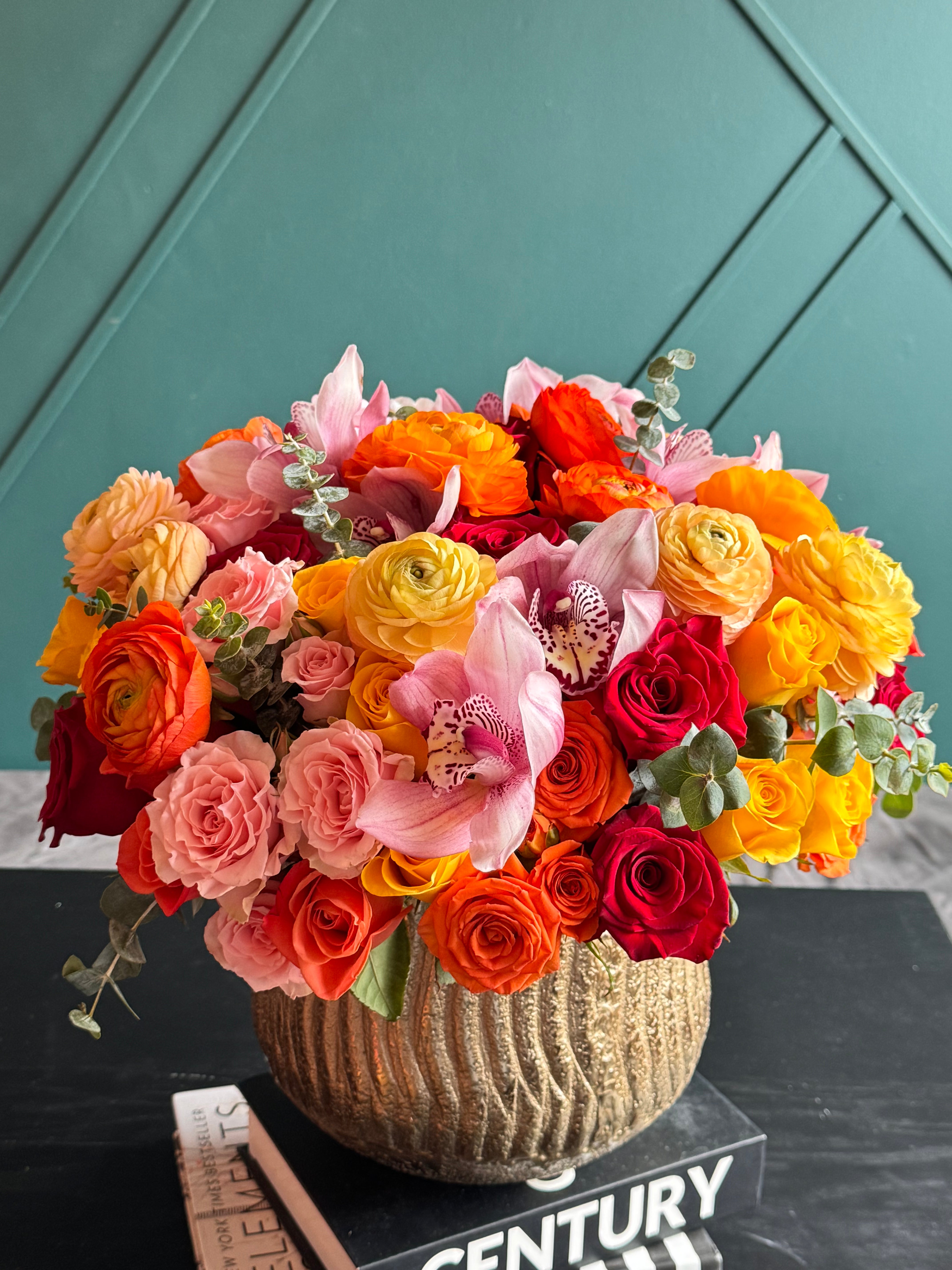 Colorful roses ranunculus and orchid arrangement Miami