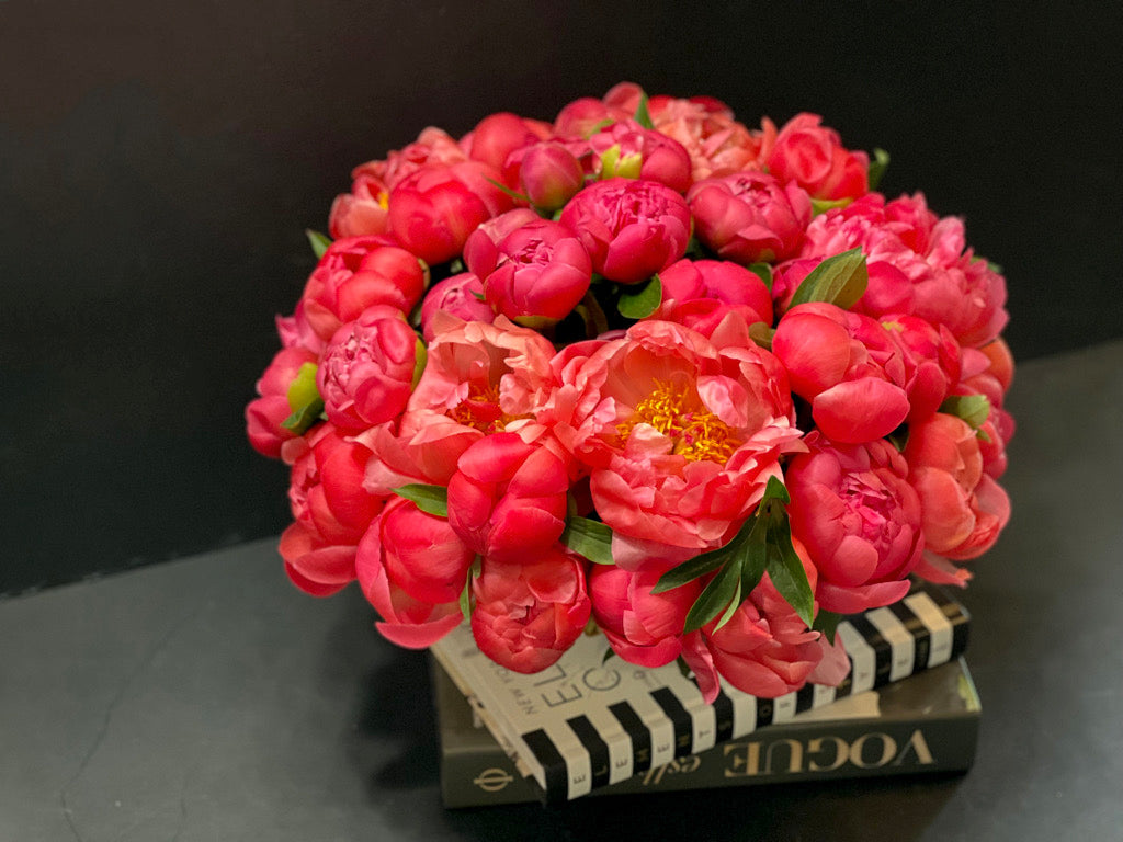 Coral peony arrangement in handmade cement vase