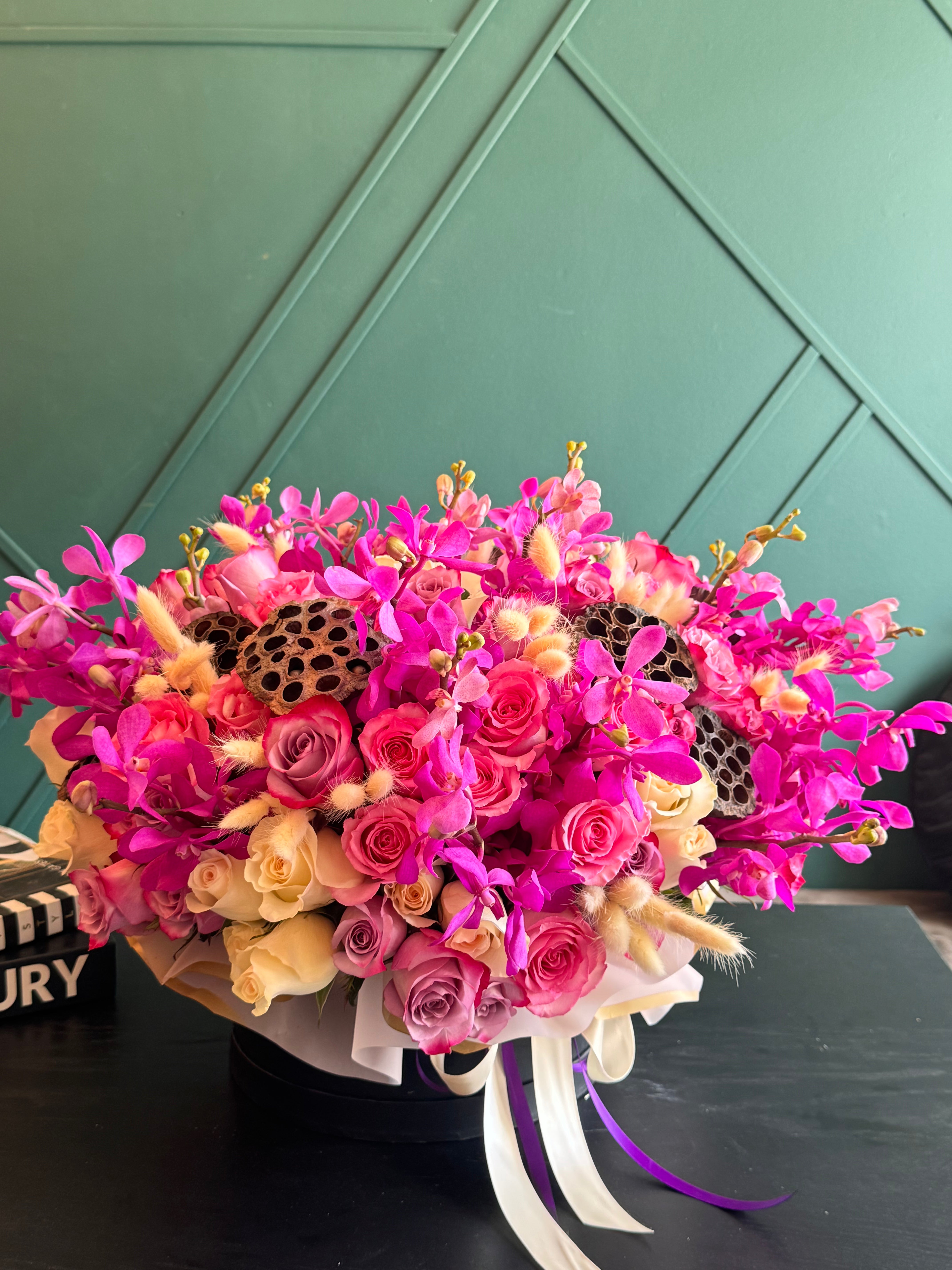 Designer Mokara orchid and rose arrangement Miami