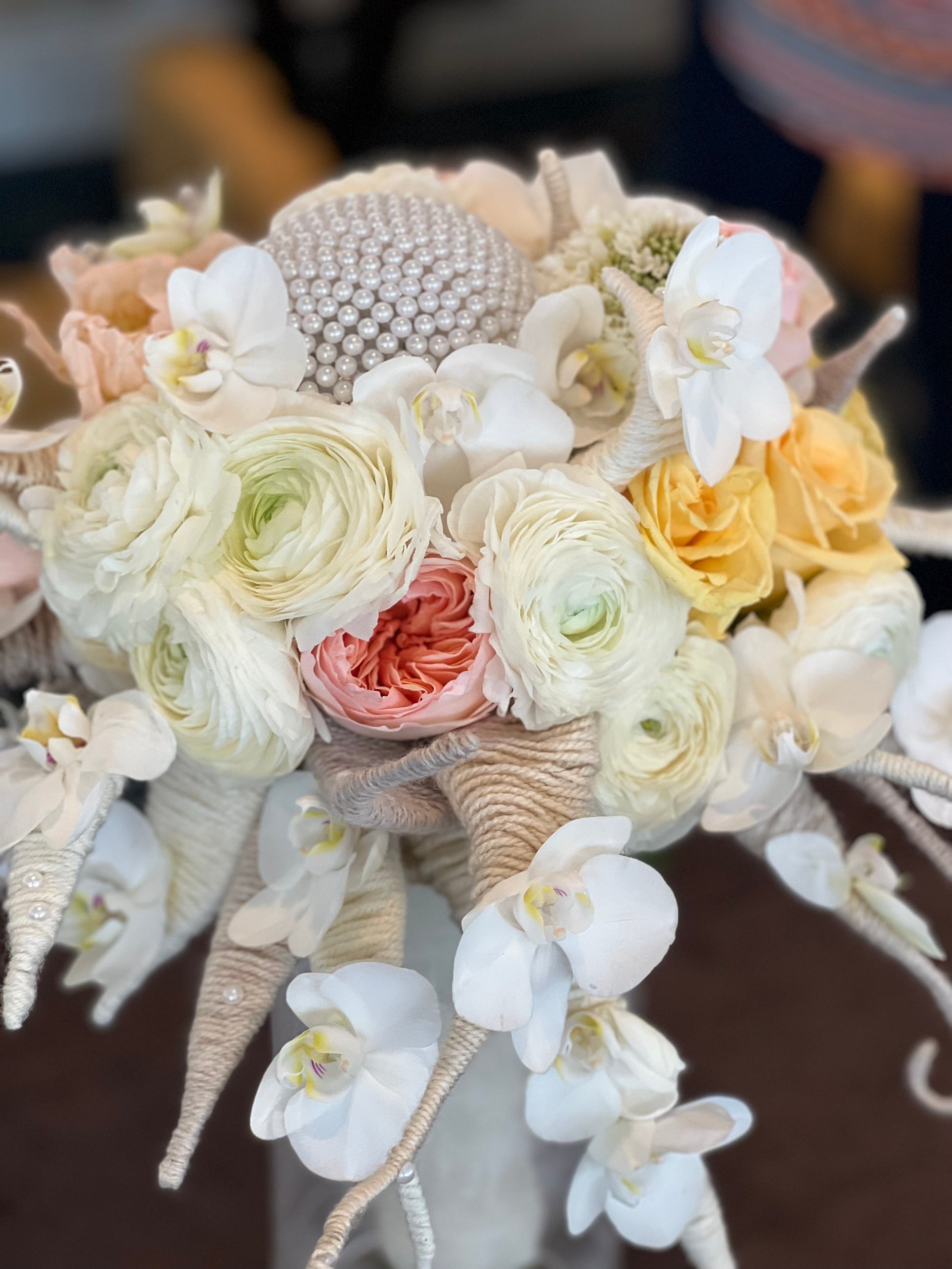 Designer bridal bouquet with orchids ranunculus and premium flowers
