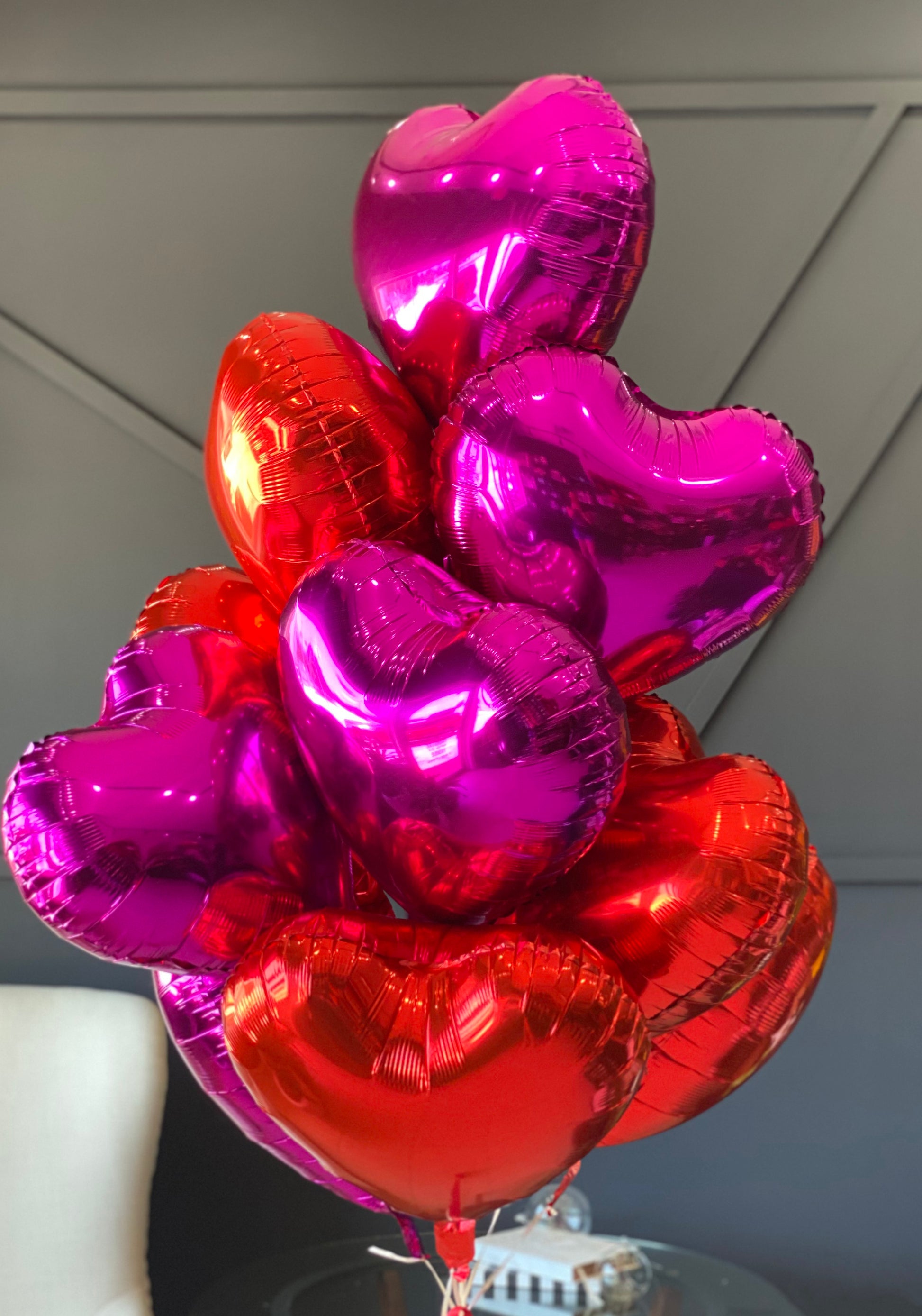 Dozen red and hot pink heart balloon bouquet by Luxury Flowers Miami
