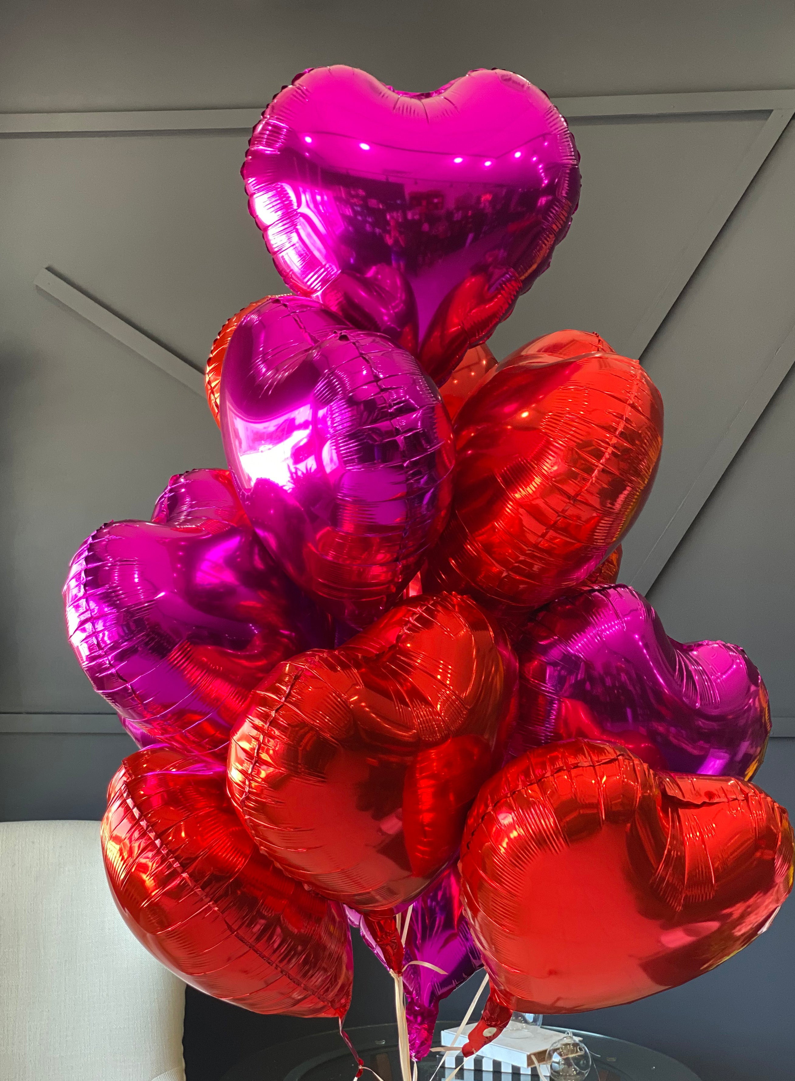 Dozen red and hot pink heart balloon bouquet for delivery in Miami