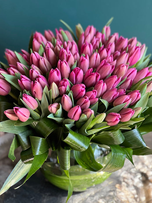 75 Pink Tulips In Fishbowl Clear Vase