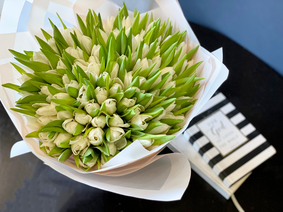 Elegant 150 white tulip bouquet for special occasion
