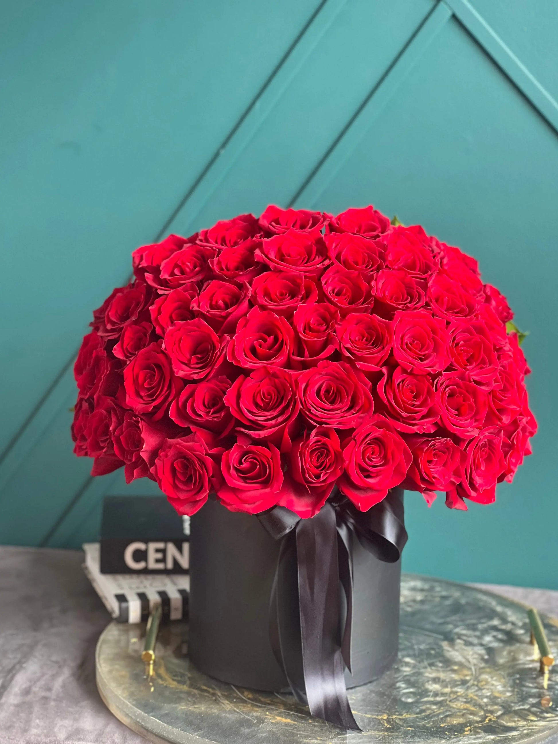 Elegant arrangement of 50 fresh red roses with same-day delivery in Miami
