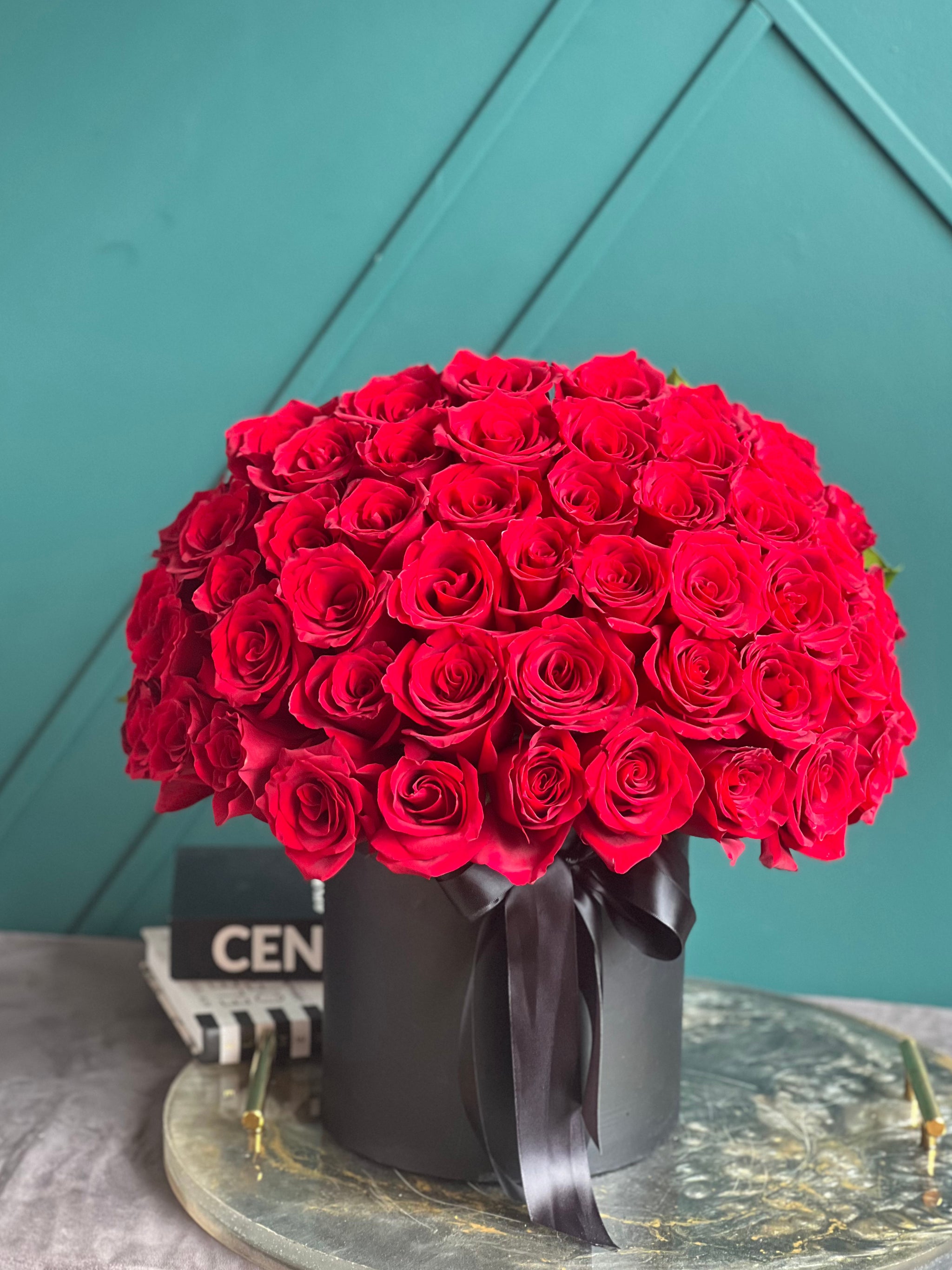 Elegant arrangement of 50 fresh red roses with same-day delivery in Miami