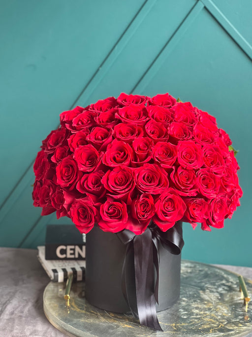 Elegant arrangement of 50 fresh red roses with same-day delivery in Miami