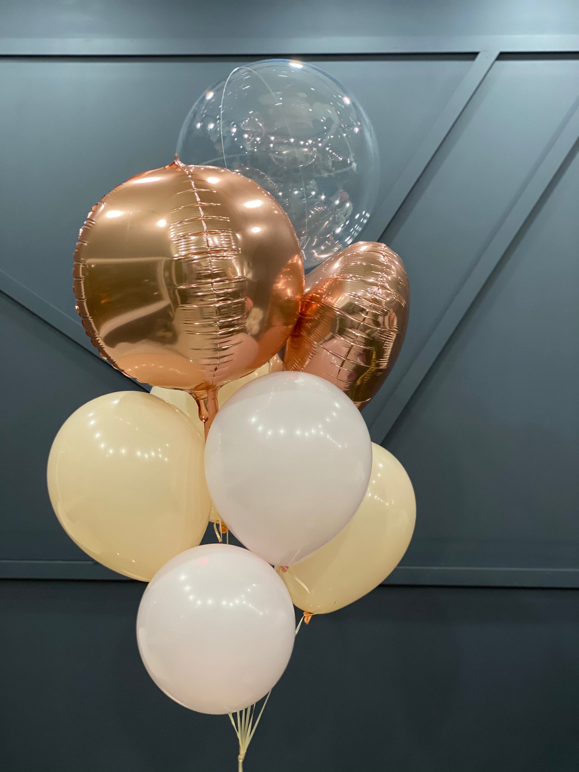 Elegant balloon bouquet with champagne gold cream and clear balloons