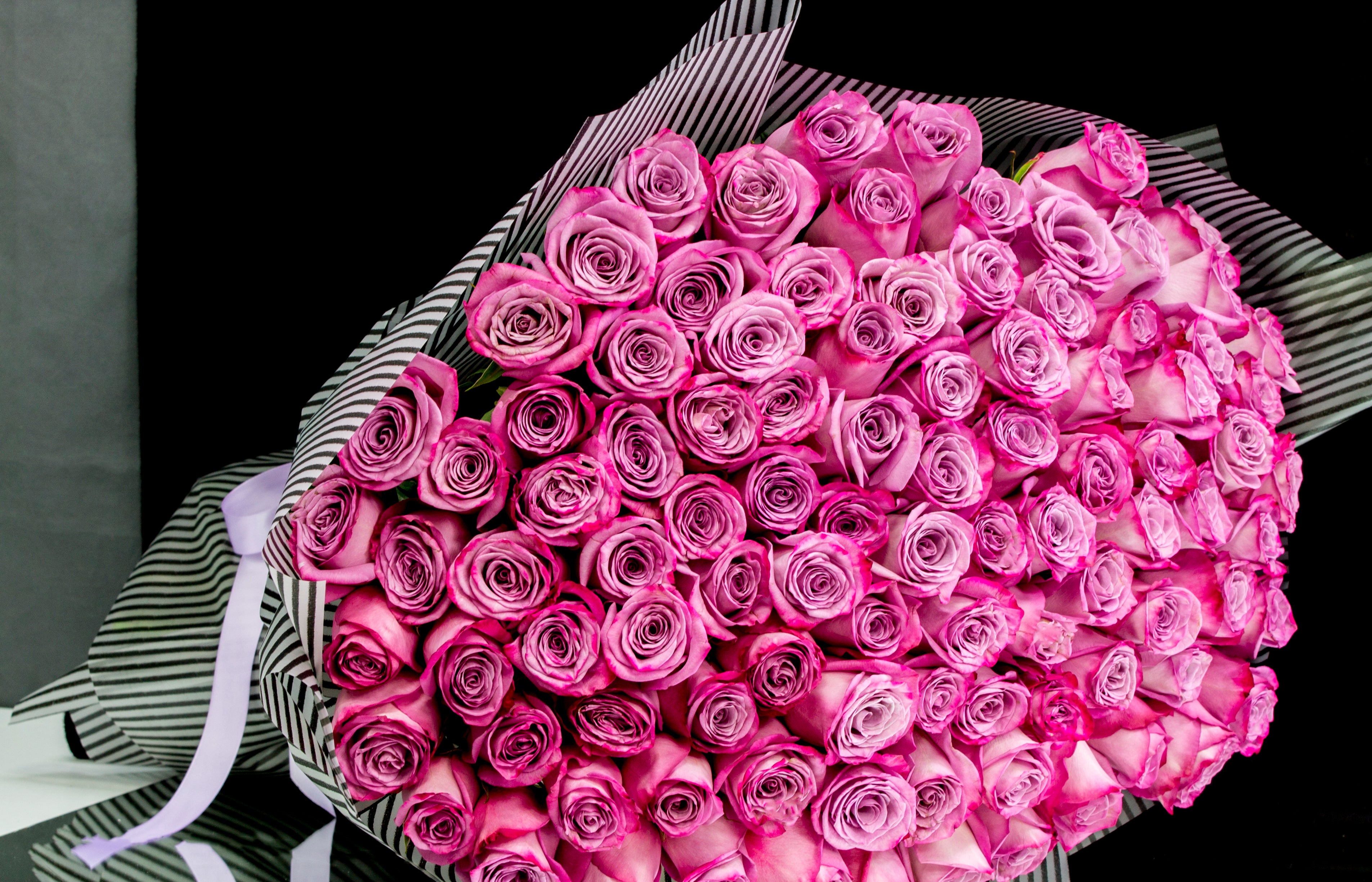 Elegant deep purple rose bouquet for same-day Miami delivery