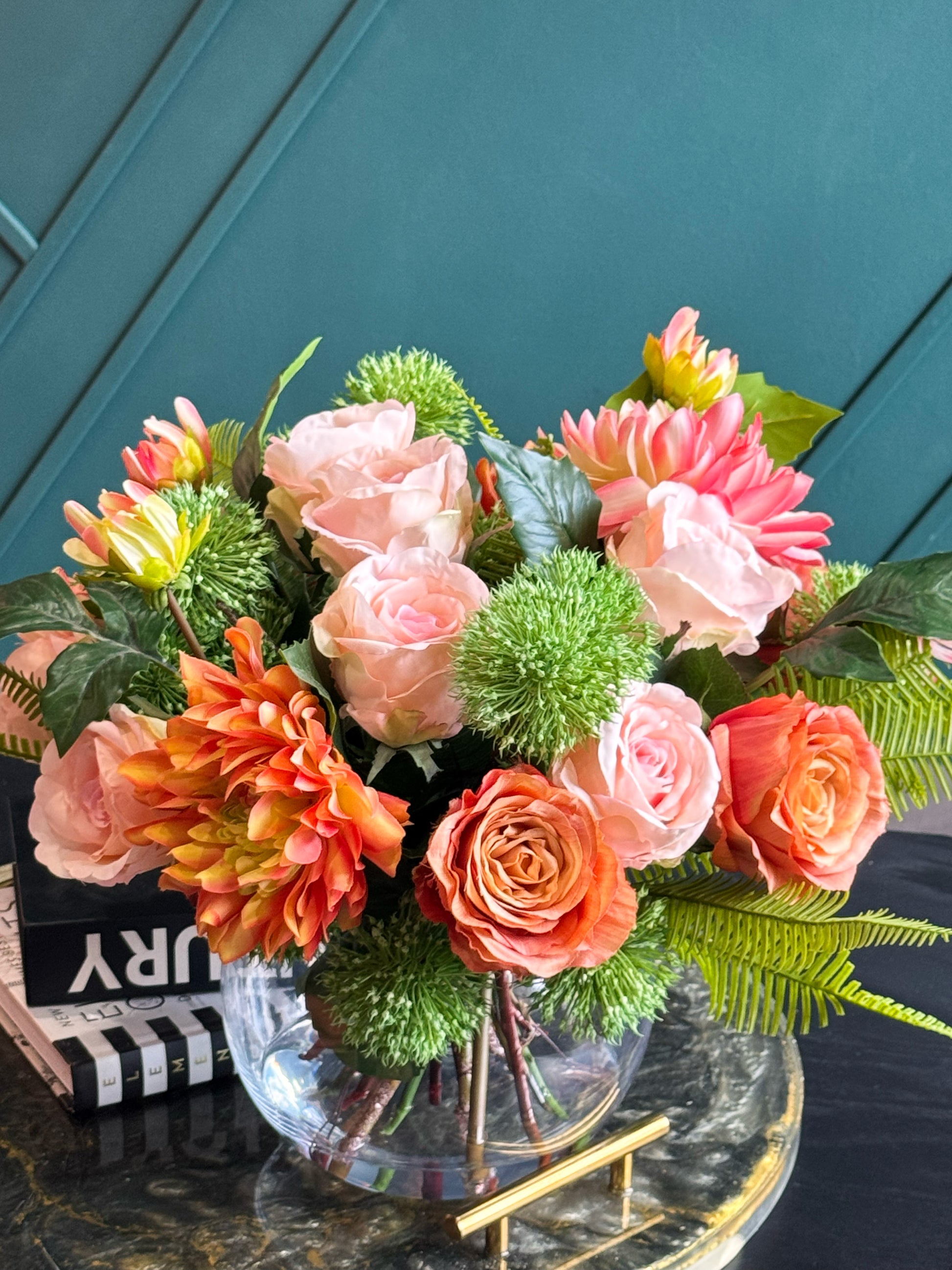 Elegant faux floral arrangement in a modern glass vase for luxury home décor.